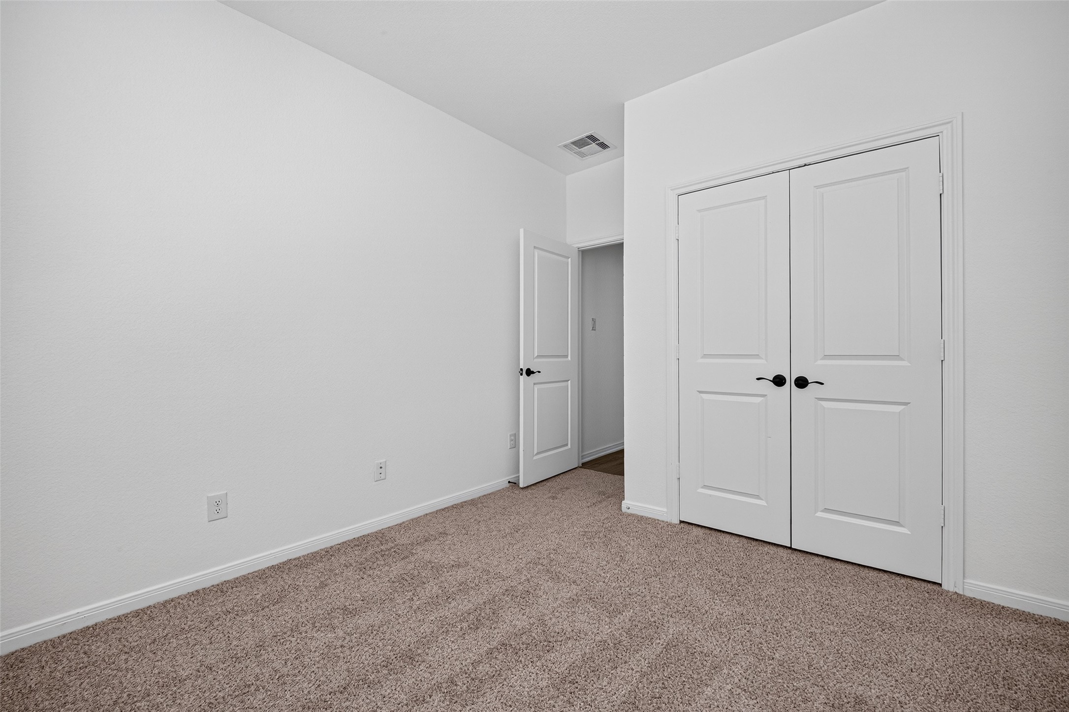 Secondary bedroom, and closet