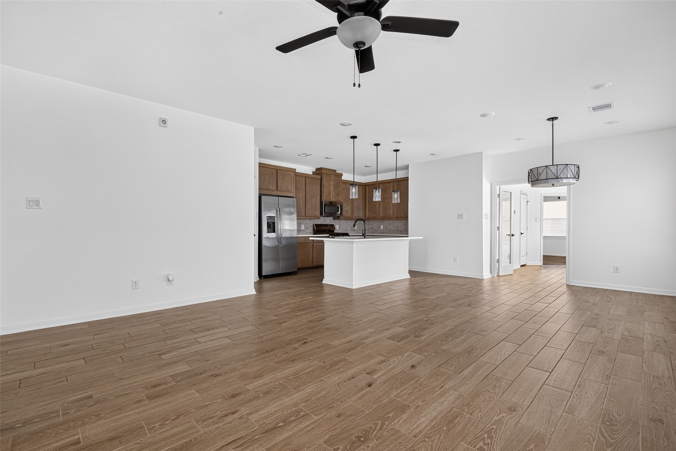 Open concept kitchen, living and dining area Open concept kitchen, living and dining area