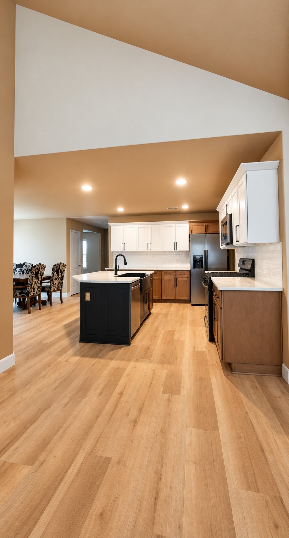 Vie of the kitchen from the family room, featuring open concept