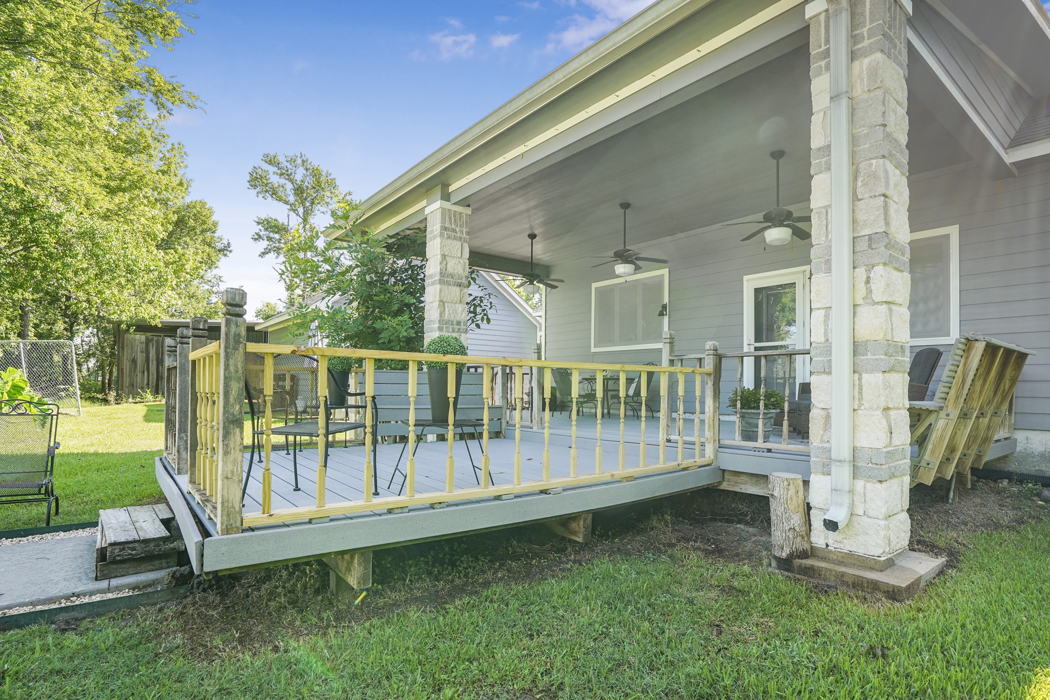 Deck off of the main house overlooks the pool