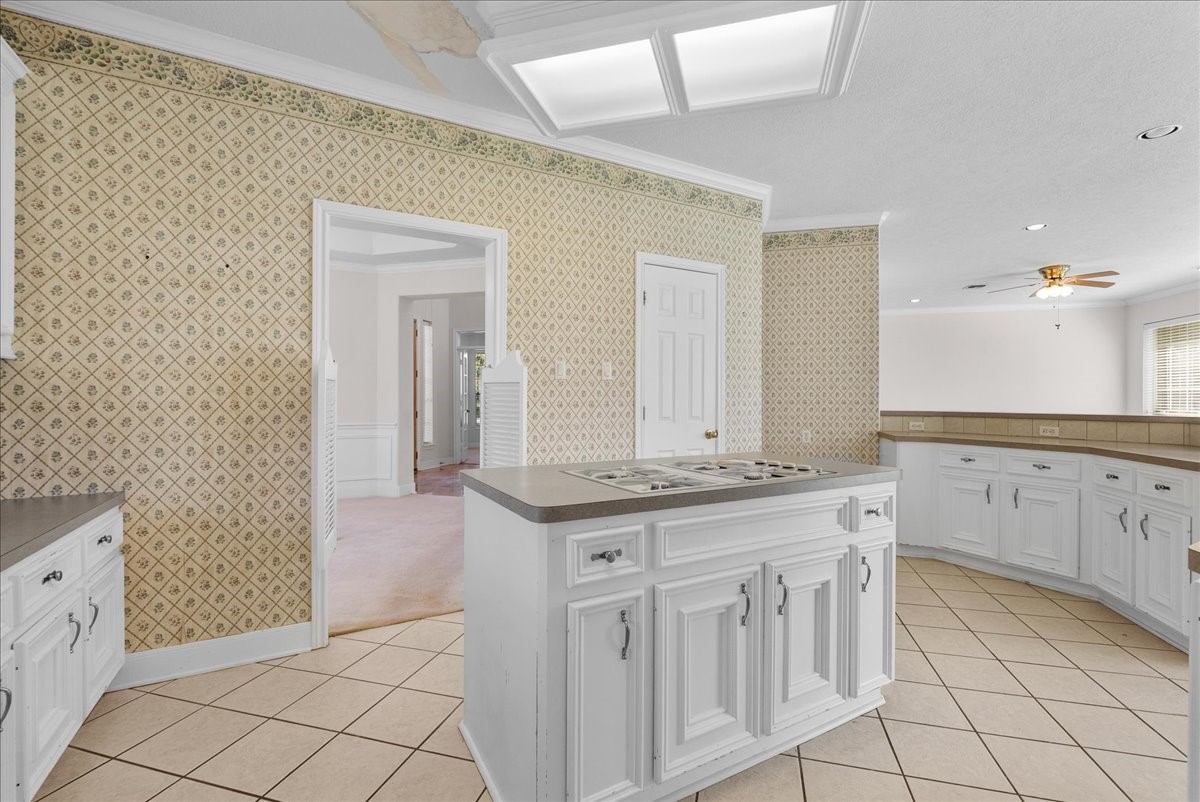 Measuring an expansive 18x14 feet, this generous kitchen is illuminated by daylight.