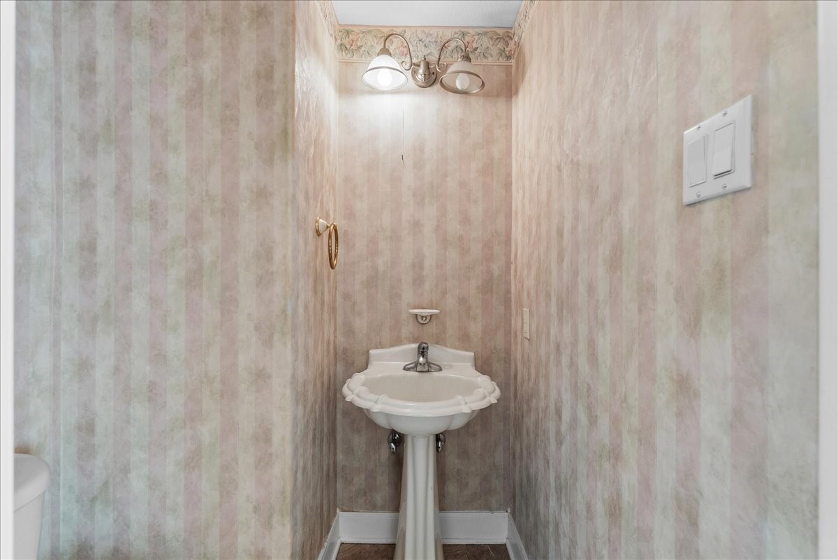 This dedicated first-floor powder room provides essential convenience for guests.