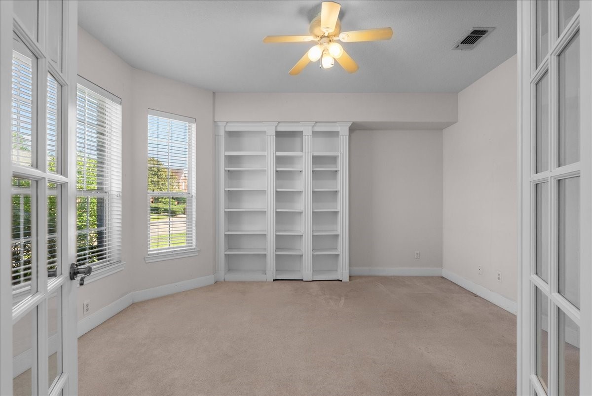 Expansive bay windows fill this private study with energizing natural light.