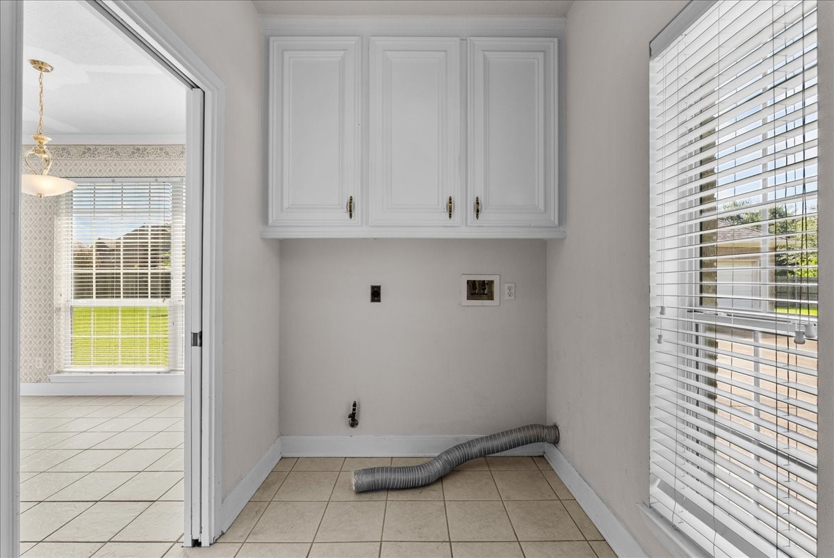 Dedicated hookups easily accommodate a full-size washer and dryer.