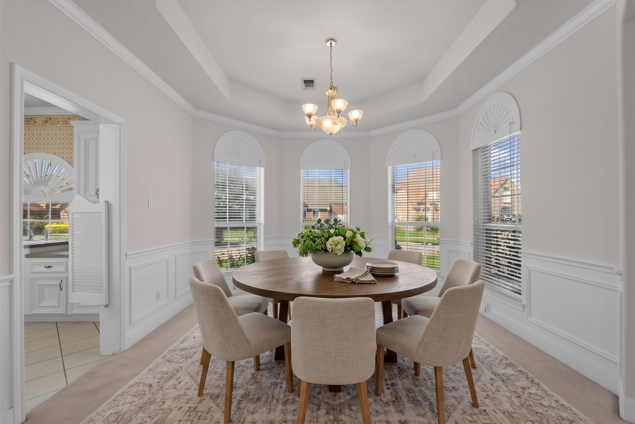 Generously sized formal dining room designed for hosting dinner parties.