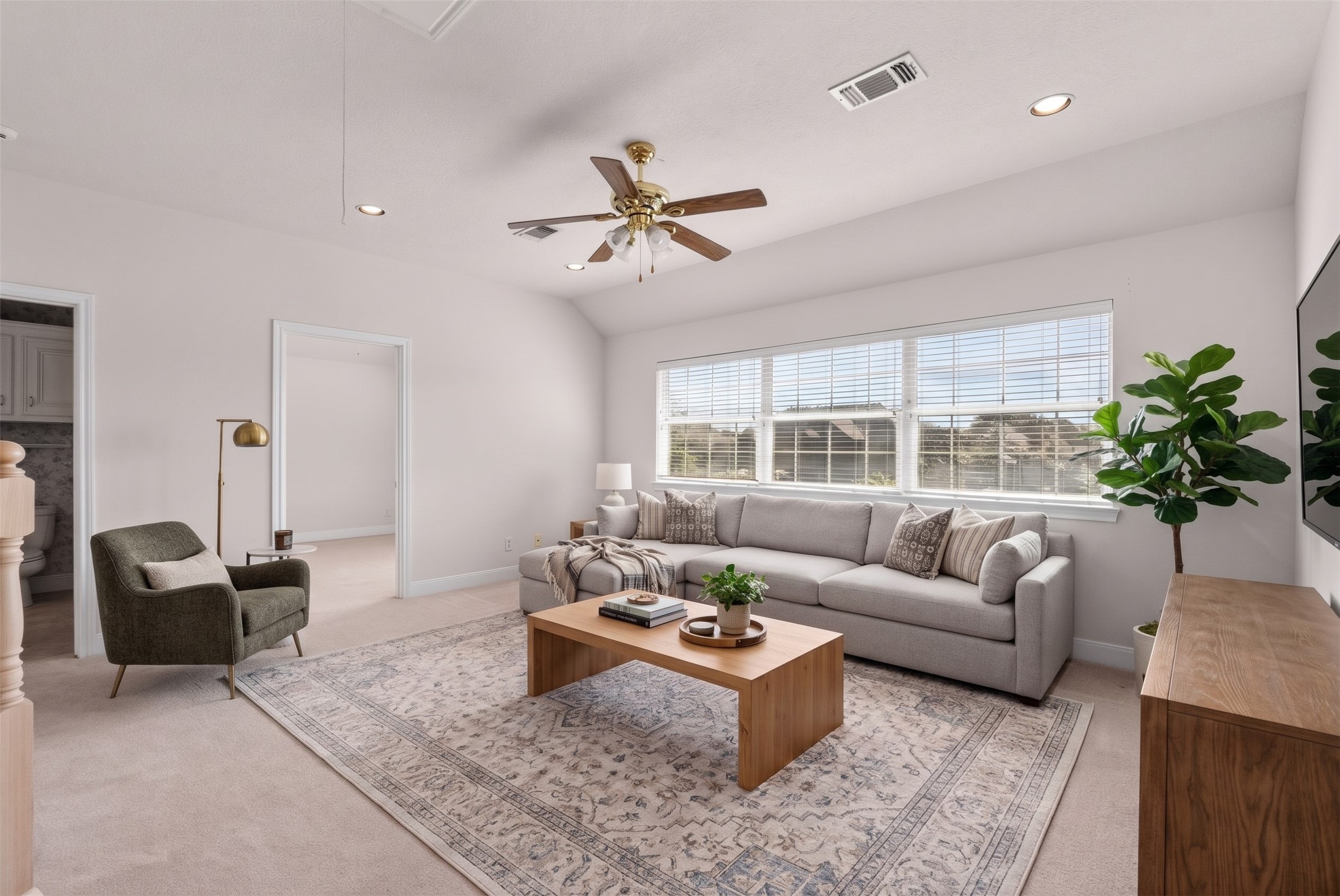 Sunlight pours through expansive windows to illuminate this 20-foot upstairs game room.