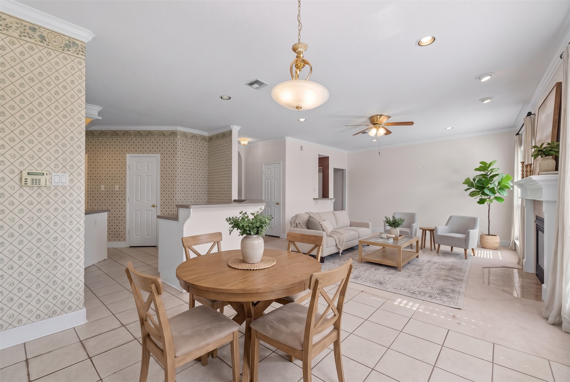 Streaming sunlight naturally warms this inviting breakfast space, eliminating the need for daytime lights.