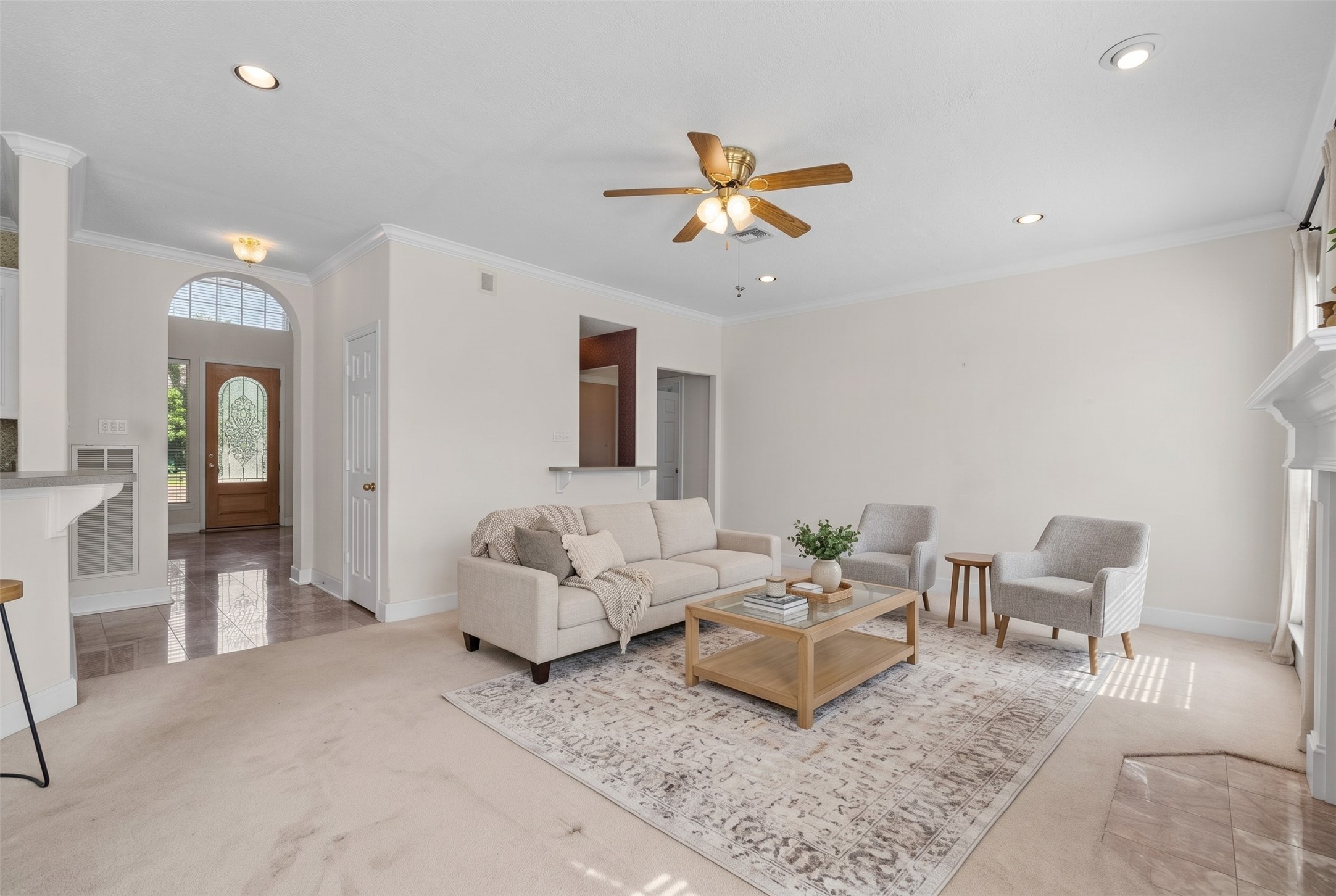 Looking back toward the entry, this view highlights how high ceilings and daylight combine to give the room an airy, unconfined ambiance.