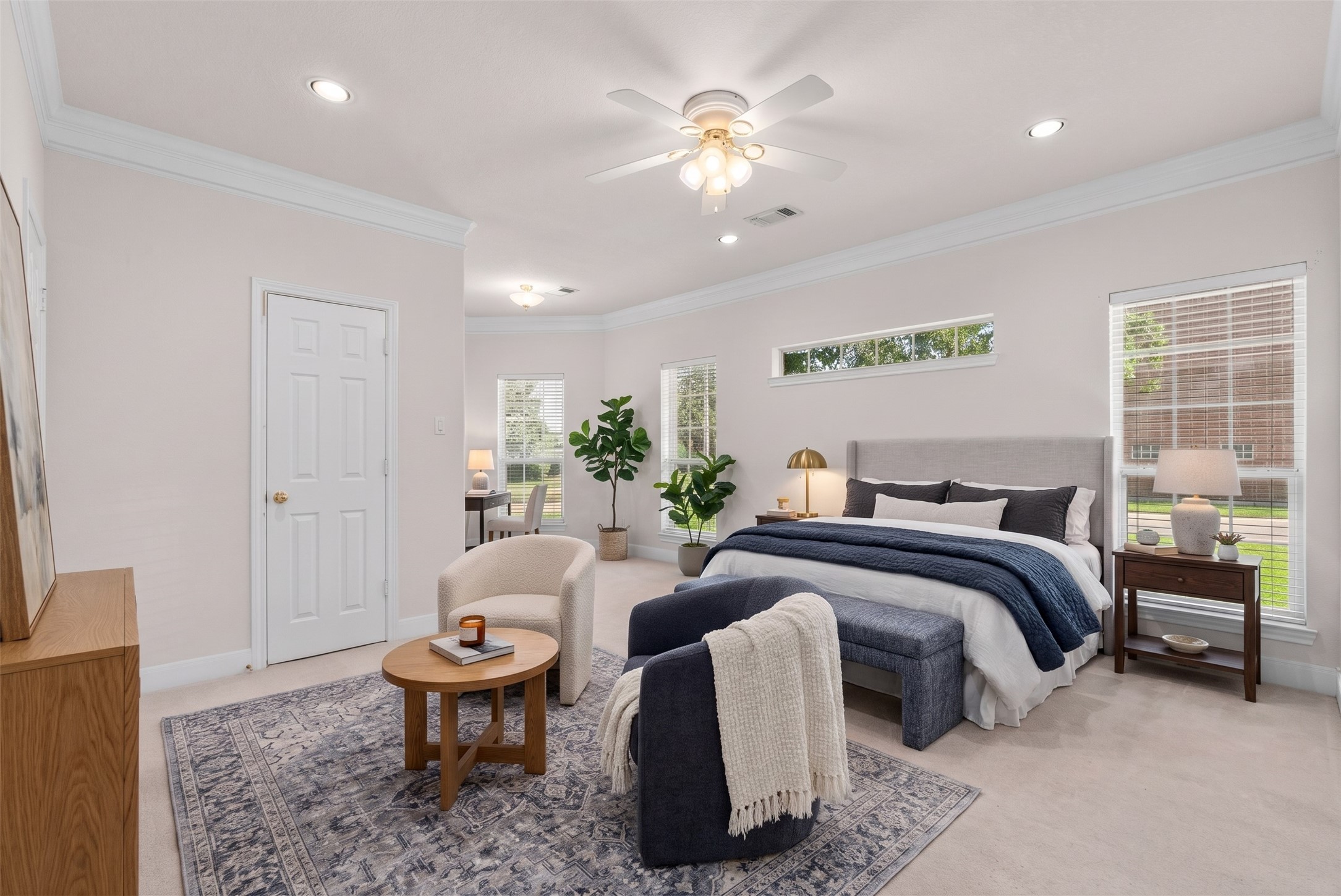 Soft natural light pours through side windows to illuminate this expansive 14x23 primary suite.