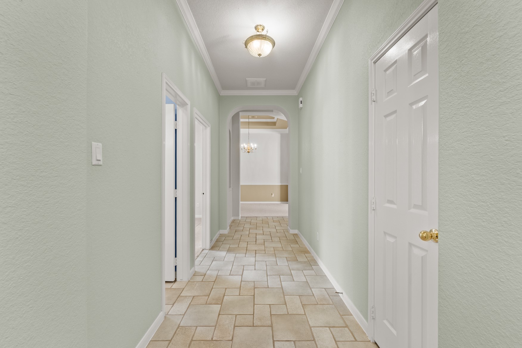 Inside, you'll immediately notice the high ceilings, elegant arches, and crown molding.