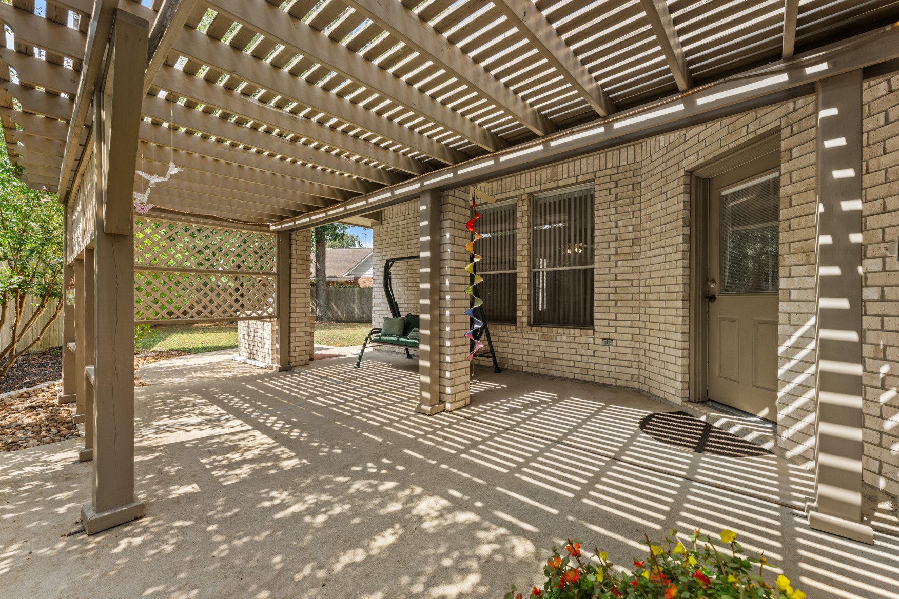 An expansive back patio can accommodate a full-sized dining table and comfy outdoor furniture!