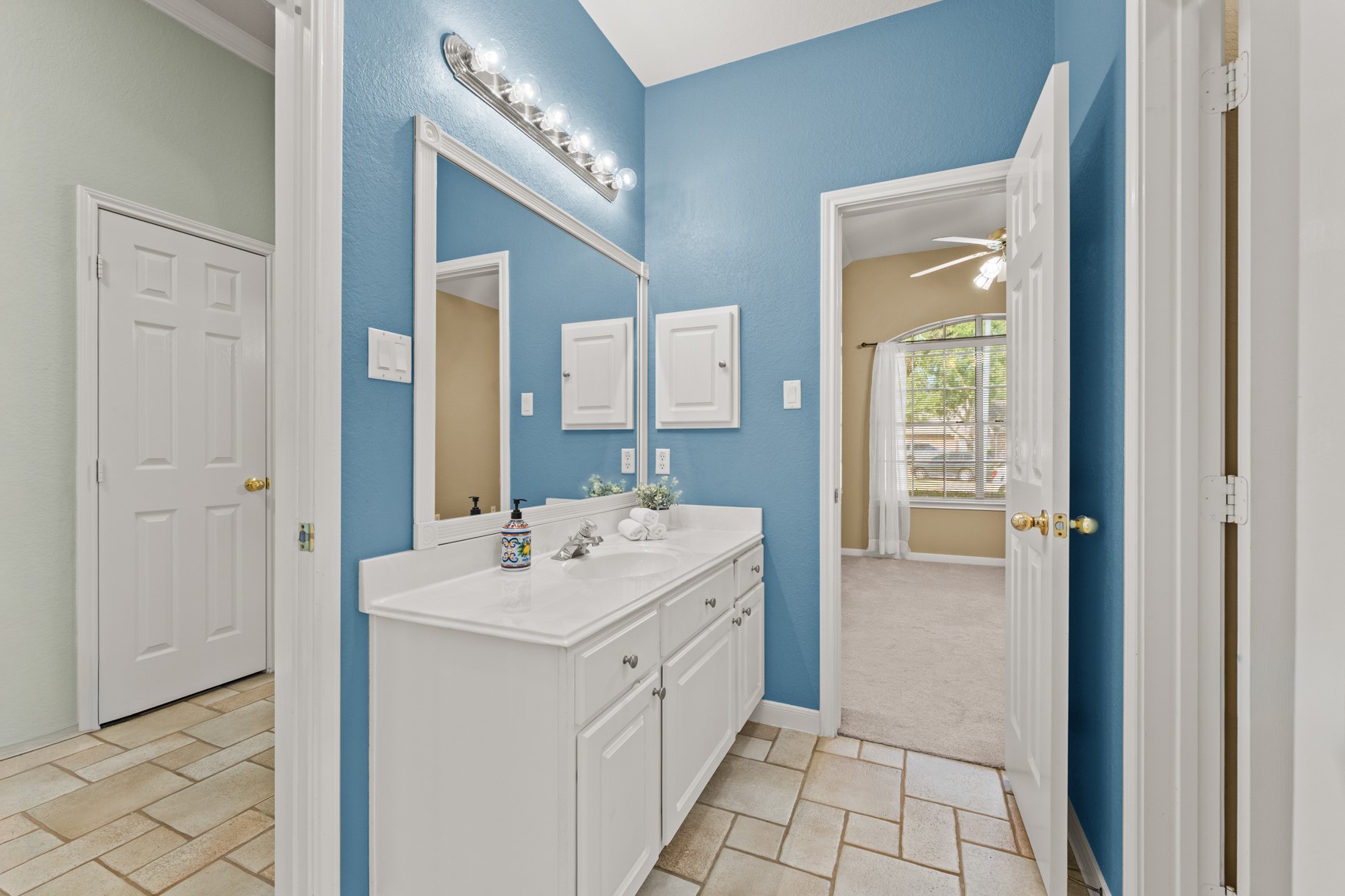 Plenty of counter space and cabinet storage to share!  This bathroom can be accessed from the entry hall also.