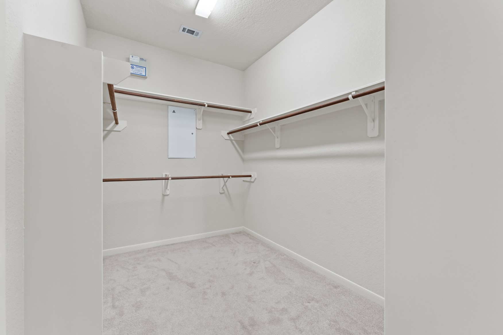 Your large walk-in closet includes built-in shelving-making it easy to stay organized!