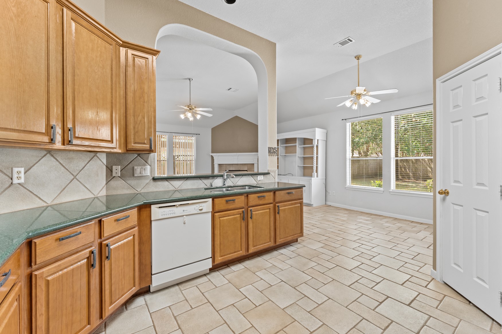 This large kitchen is open to the breakfast area and includes a LONG COUNTER - great for meal prep - and a WALK-IN PANTRY!