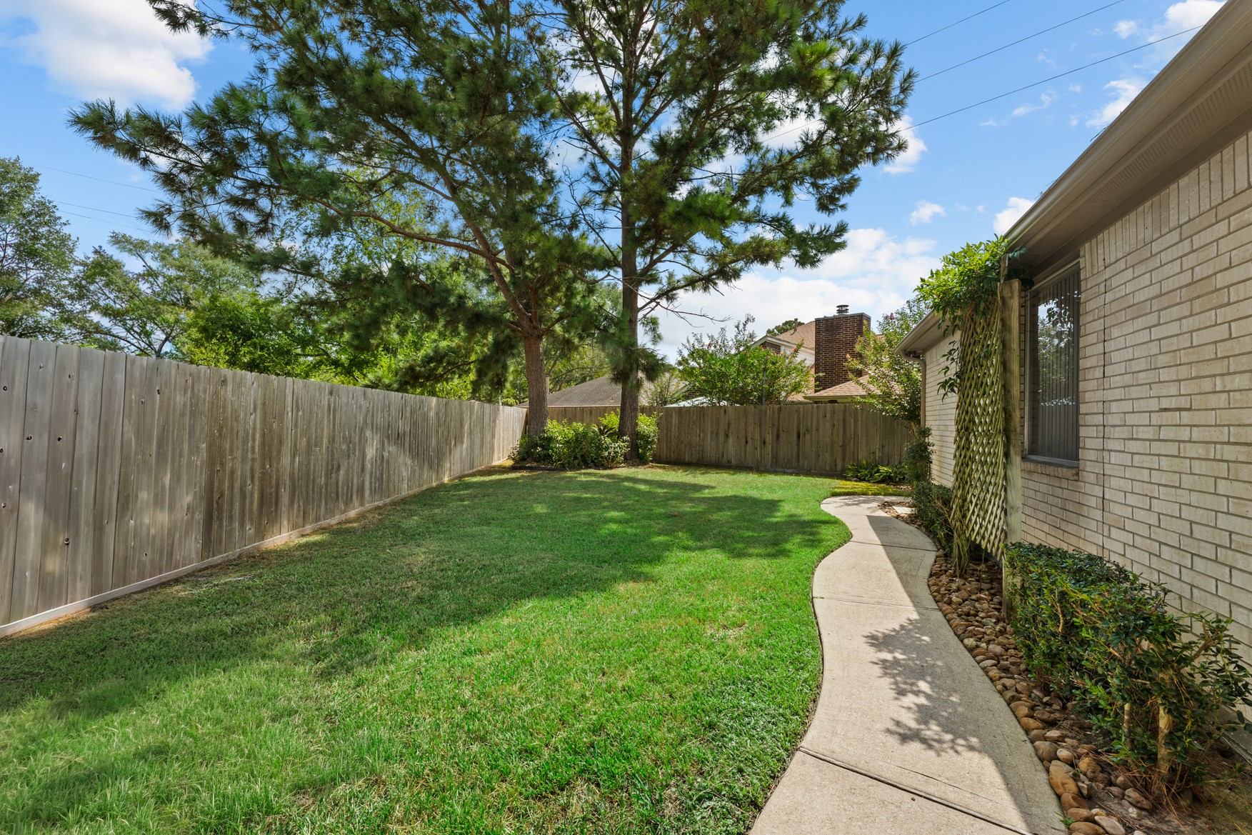 This lot provides plenty of opportunity for gardening, lawn games, and even a pool!