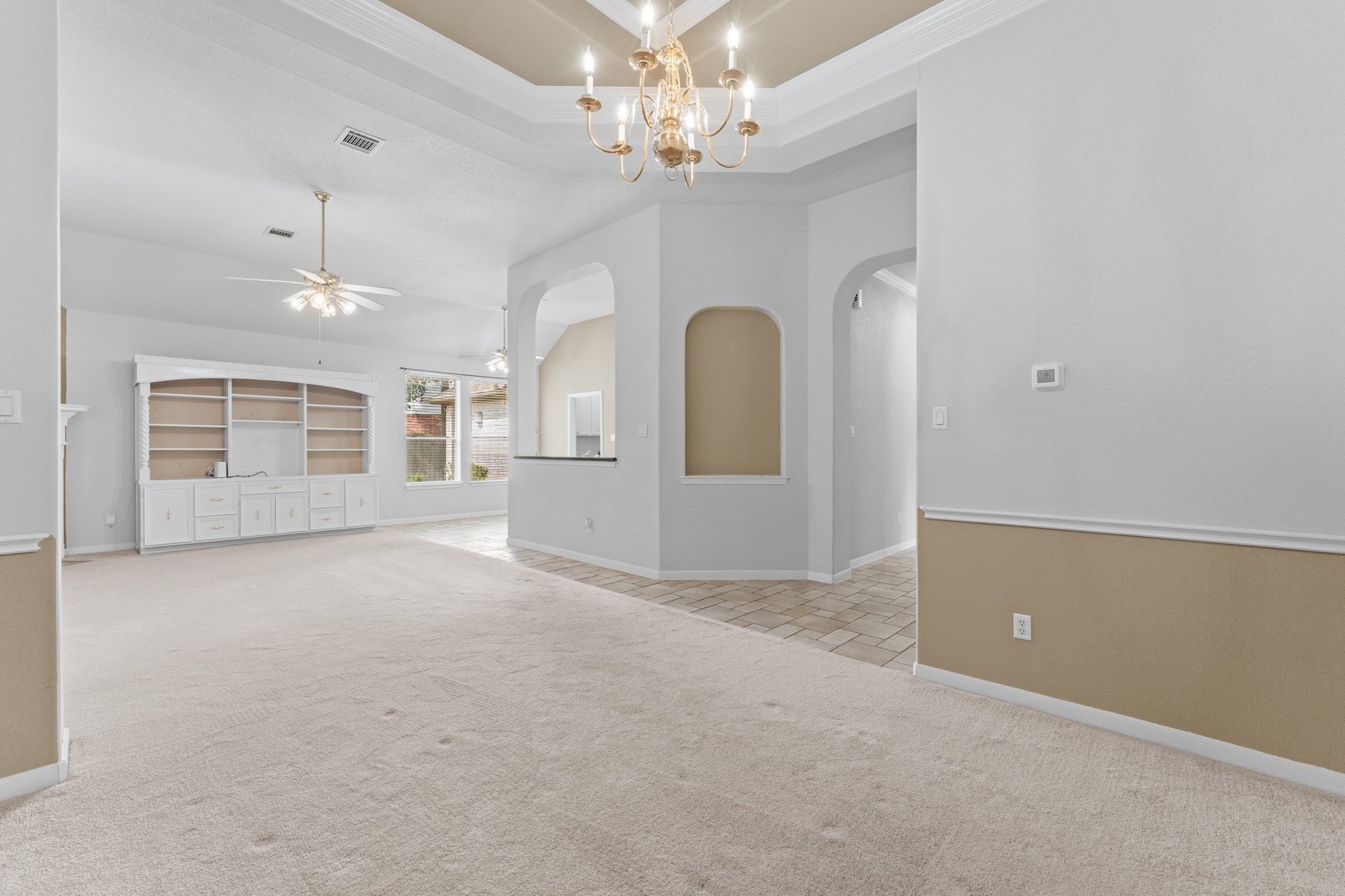 Open, spacious areas make it easy to gather with family and friends! View from the dining area looking towards the living room, kitchen, and breakfast area.