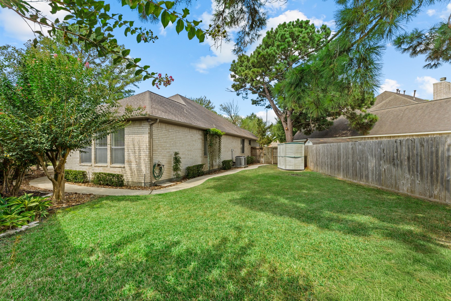 Photo of the SECOND lawn area. Brick on all four sides of this home means low maintenance.