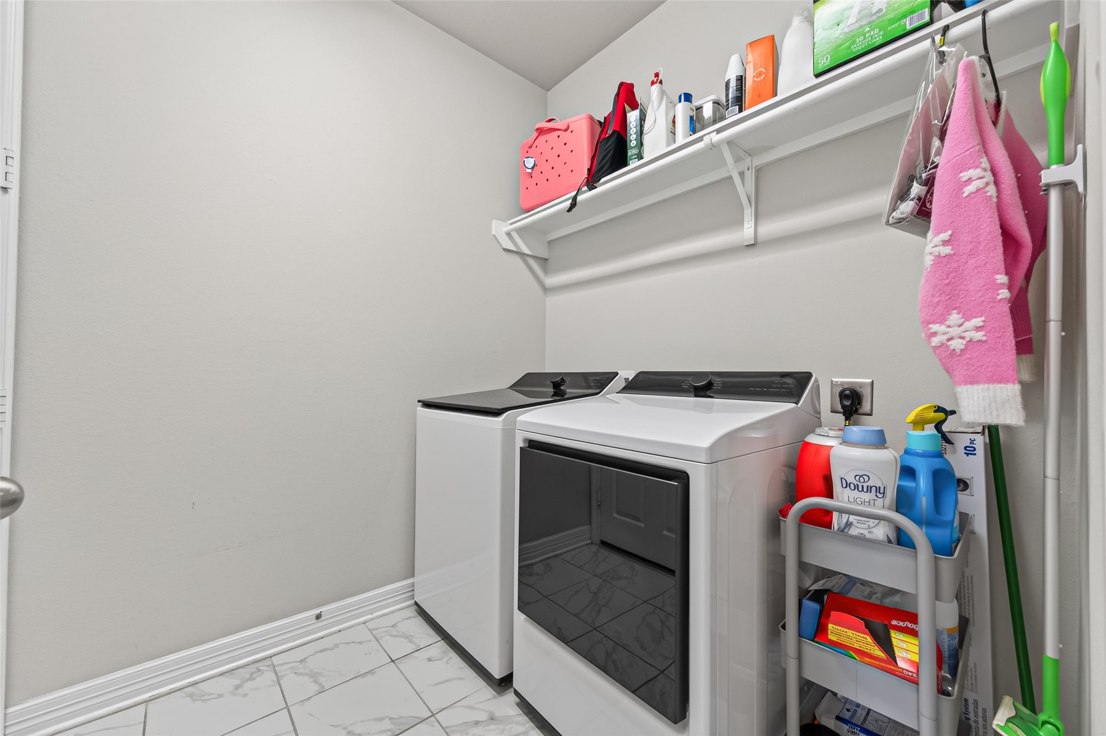 Utility room with washer and dryer