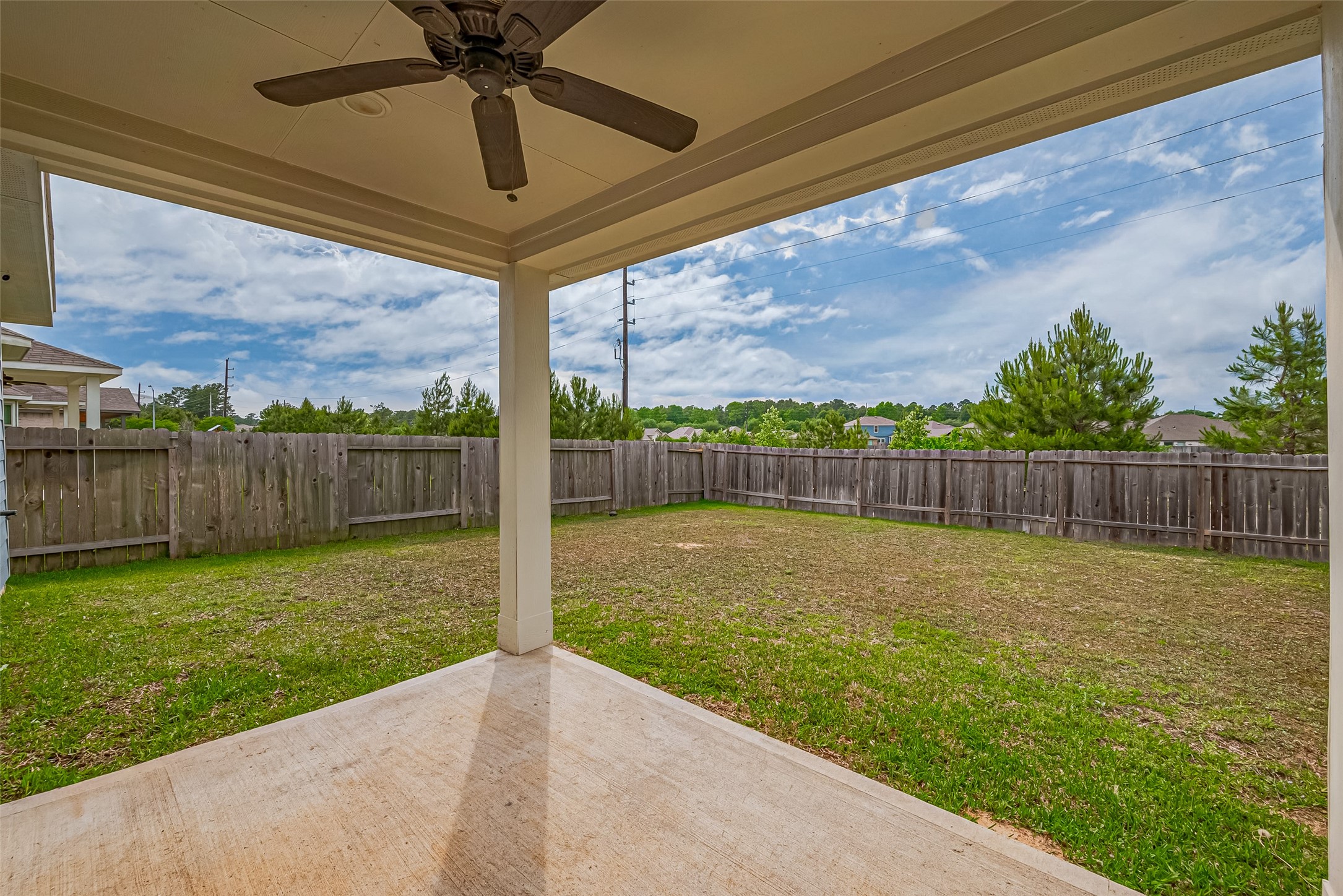 Beat the heat on the covered patio with fan!