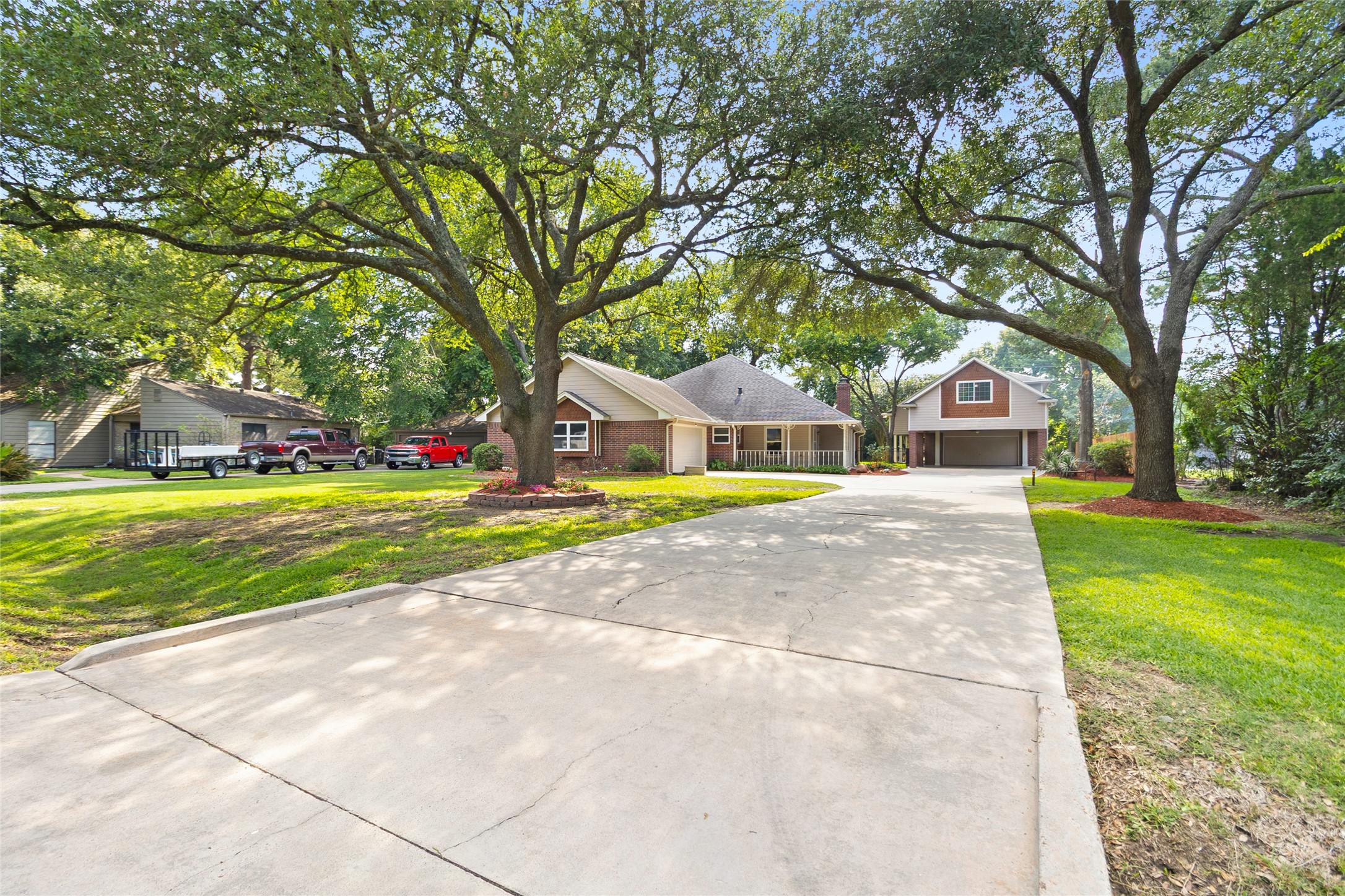 Pulling into your extra-long private driveway feels like arriving at your own peaceful retreat surrounded by towering shade trees & wide-open green space.