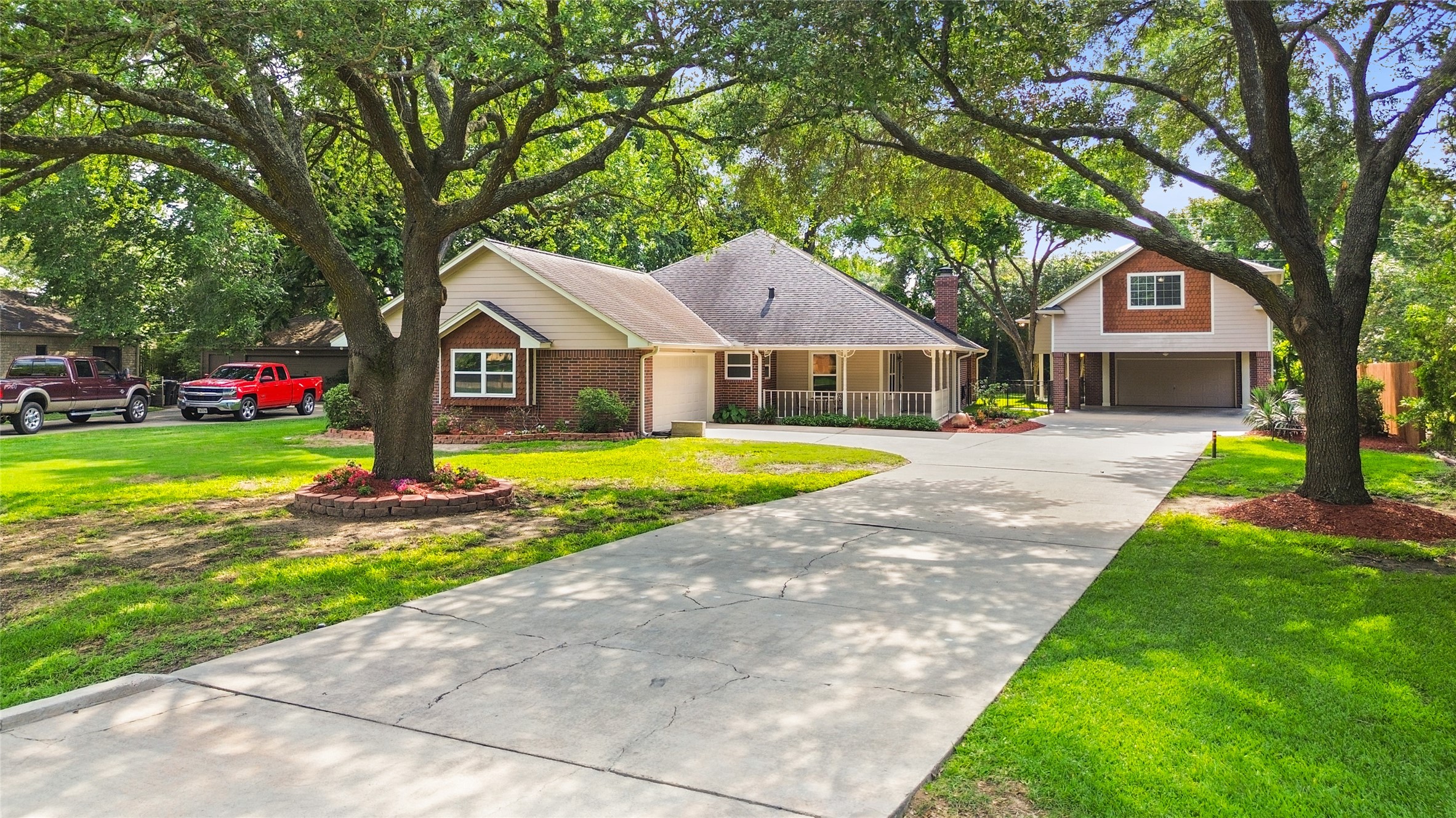 Framed by lush landscaping & mature trees, your homes inviting exterior delivers timeless charm the moment you arrive.