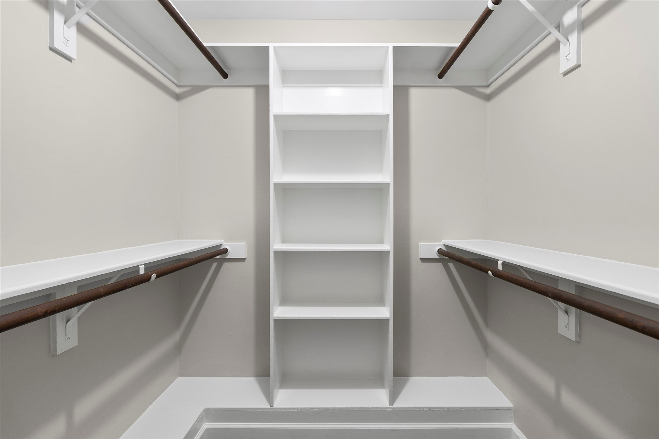 Everything has its place in your oversized walk-in closet complete with built-in shelving, double hanging space, and easy everyday organization.