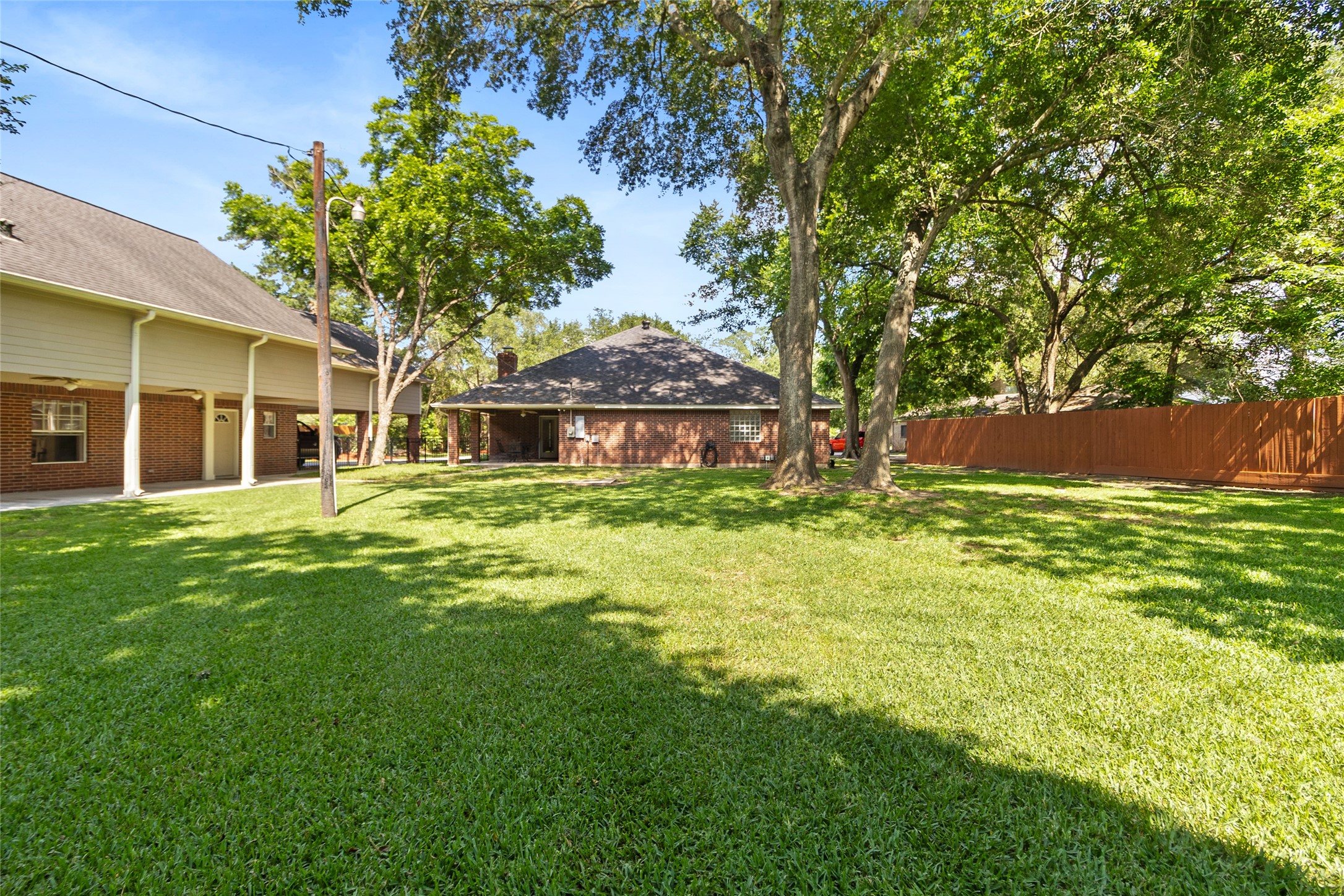 Your massive backyard gives you endless room to host gatherings, add outdoor amenities, garden, play, or simply enjoy the peaceful shade of mature trees.