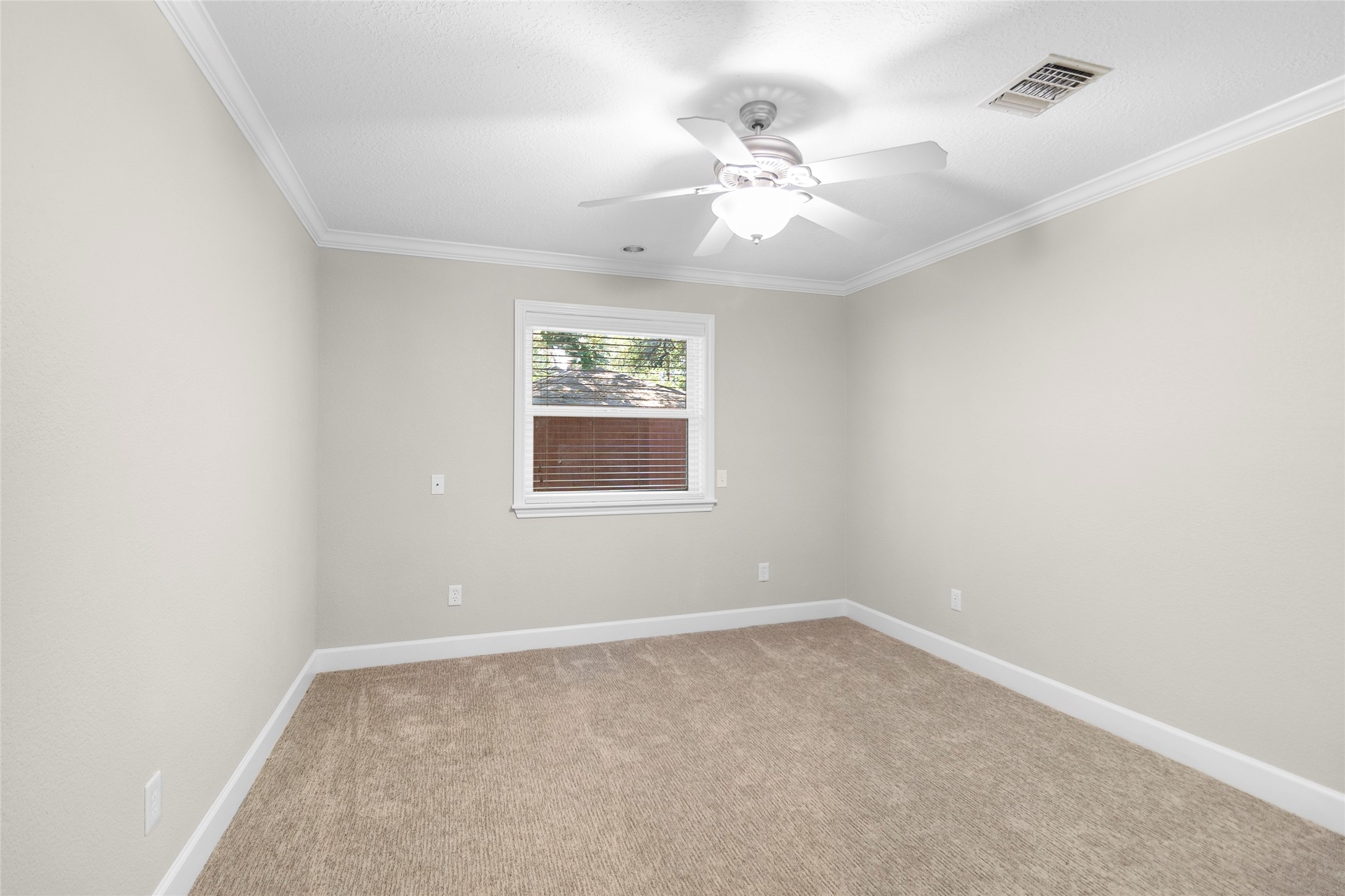 Bright, spacious, and inviting, this secondary bedroom offers the perfect setup for family, guests, or a private home office.
