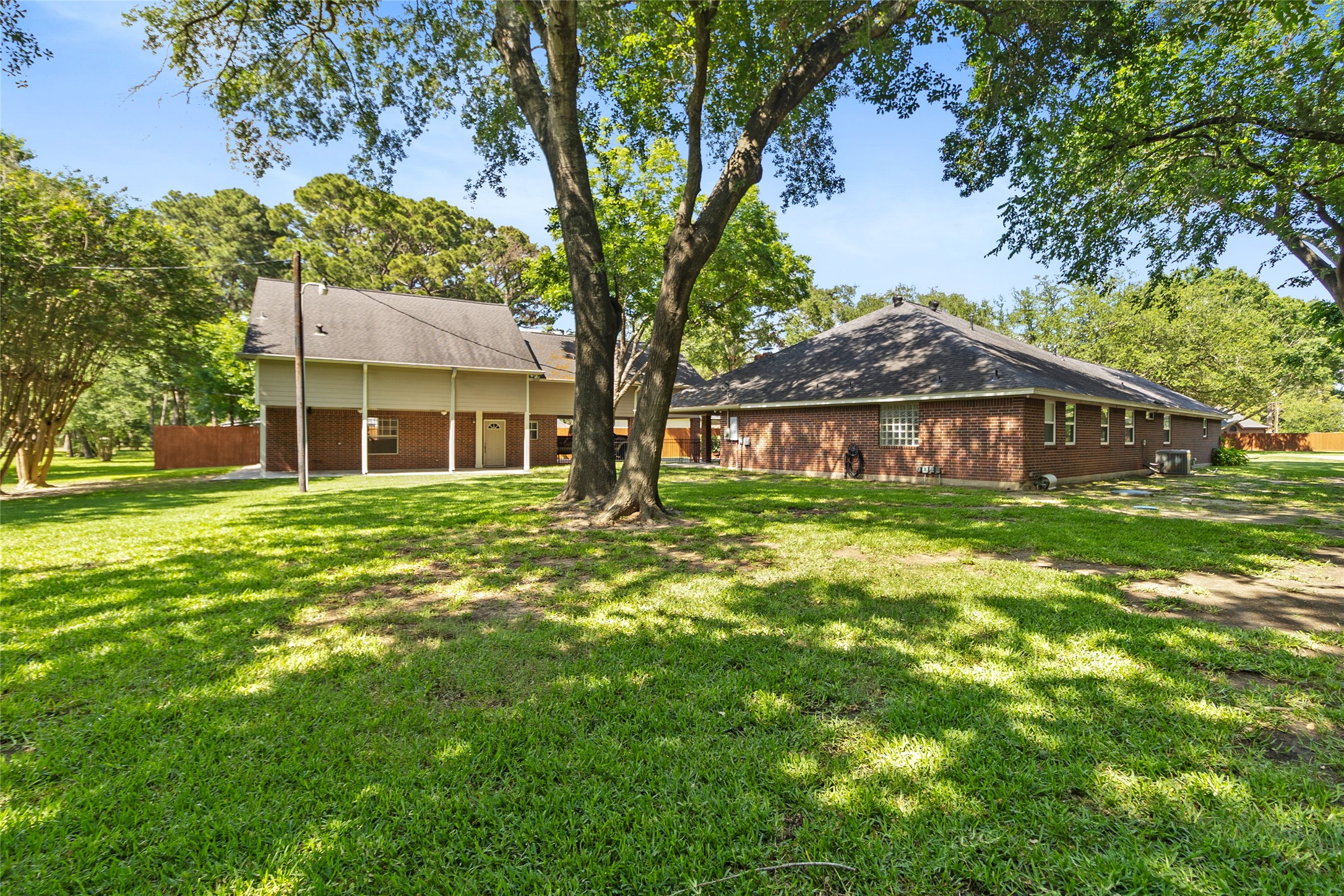 Stretch out beneath mature trees & enjoy the incredible backyard space designed for entertaining, play, gardening, or simply enjoying the quiet outdoors.