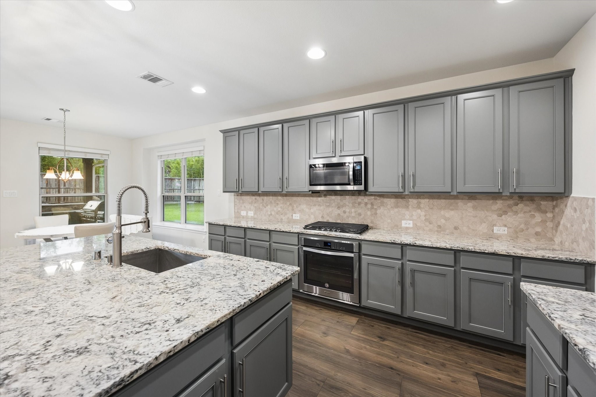 Open-concept kitchen create a bright, functional space with ample room for meal preparation and entertaining.