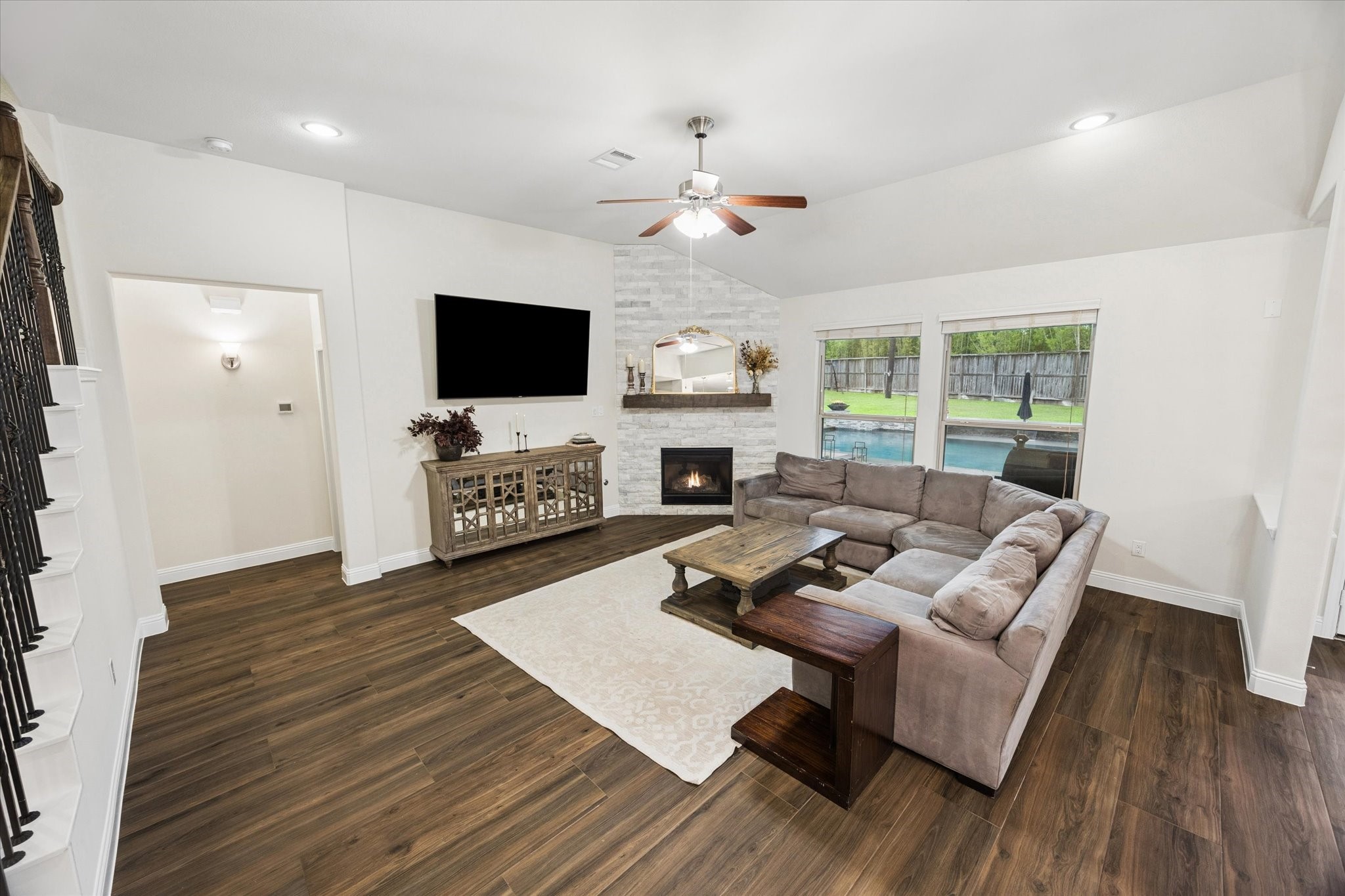 Another view of the family room large enough for generous seating options. This open layout creates a comfortable setting for relaxing or entertaining. Great site lines from the living room to the kitchen.