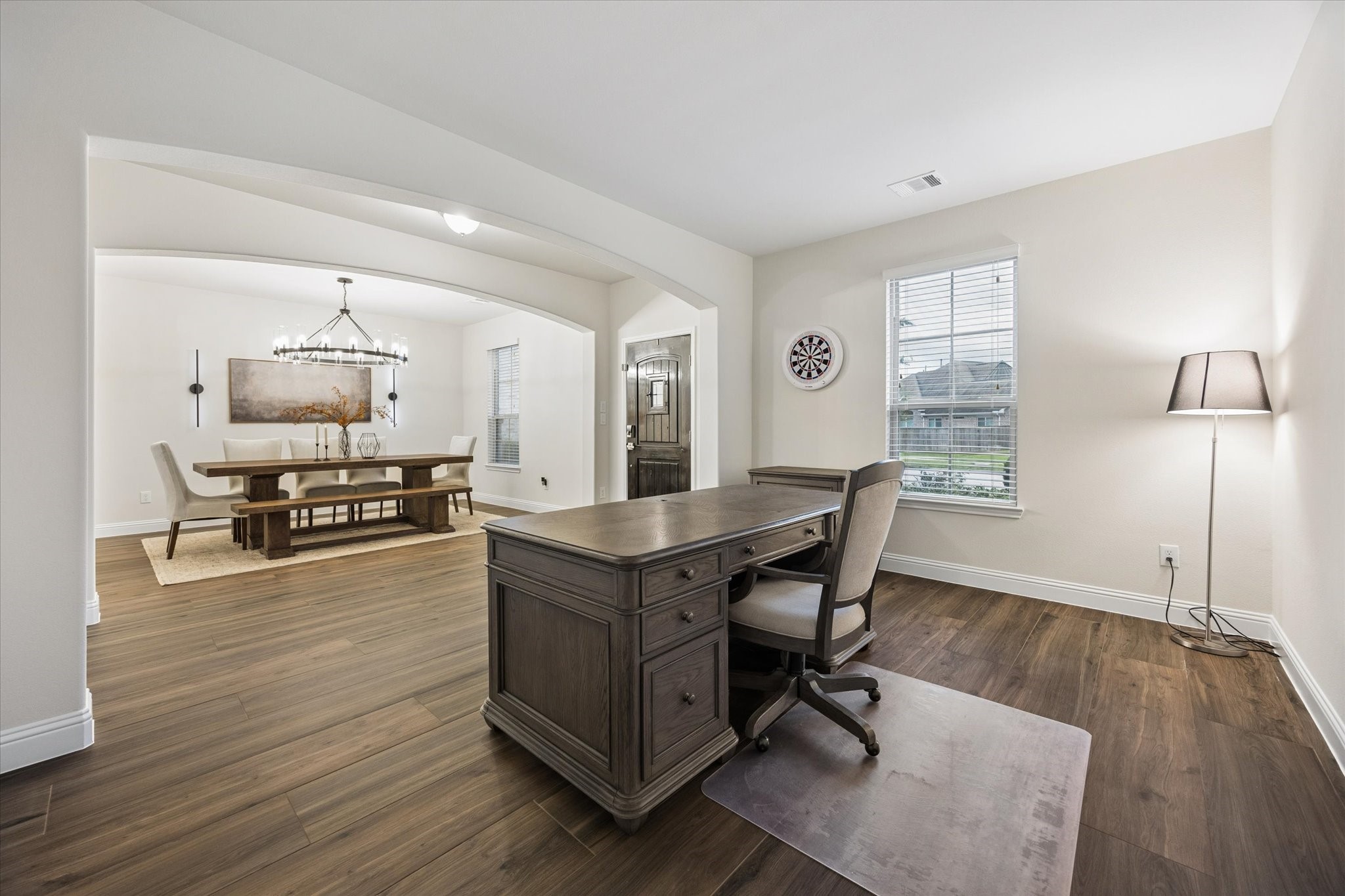 Dedicated workspace with an abundant natural light and a spacious layout that creates a versatile setting for a home office, study, or additional living area.