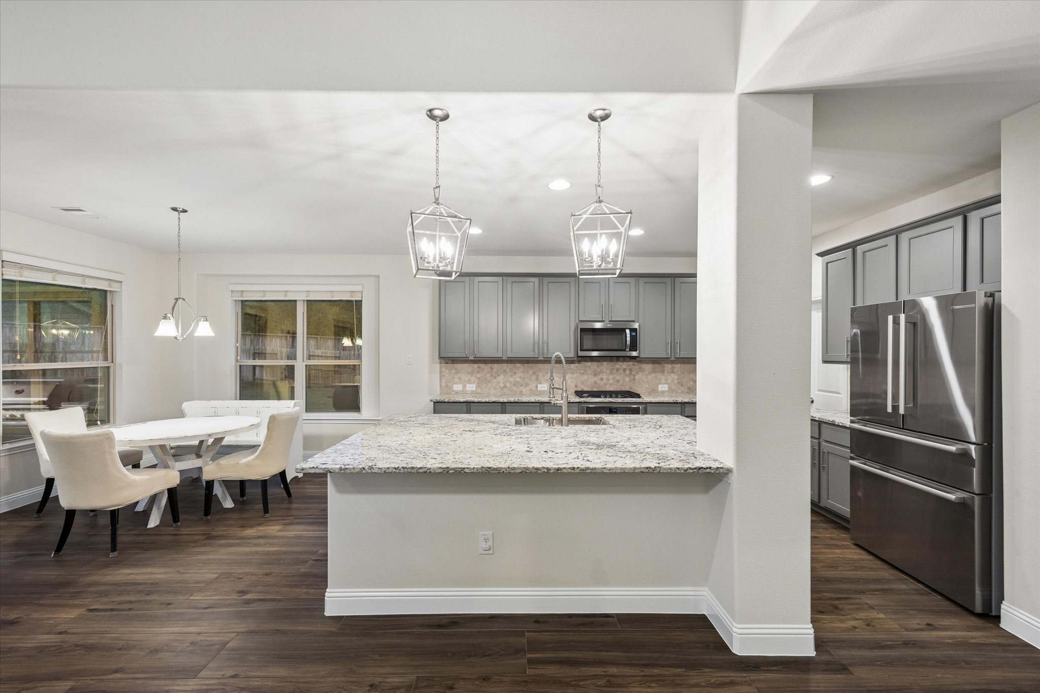 Large, centered island with plenty of cabinets for storage. Not to mention a HUGE pantry size.