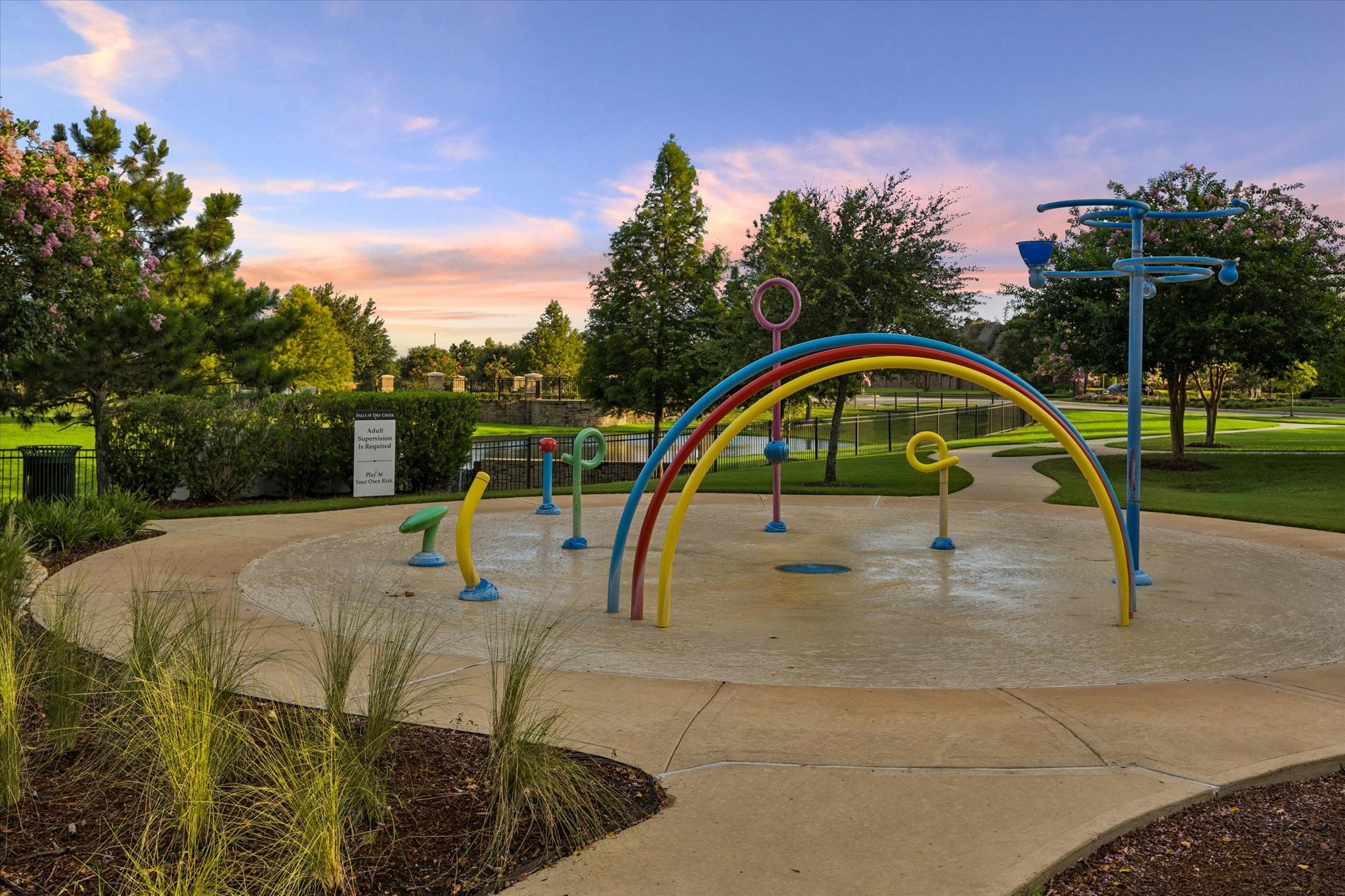 Enjoy the welcoming outdoor amenities of Falls at Dry Creek, featuring a beautifully landscaped community playground designed for fun, recreation, and connection.