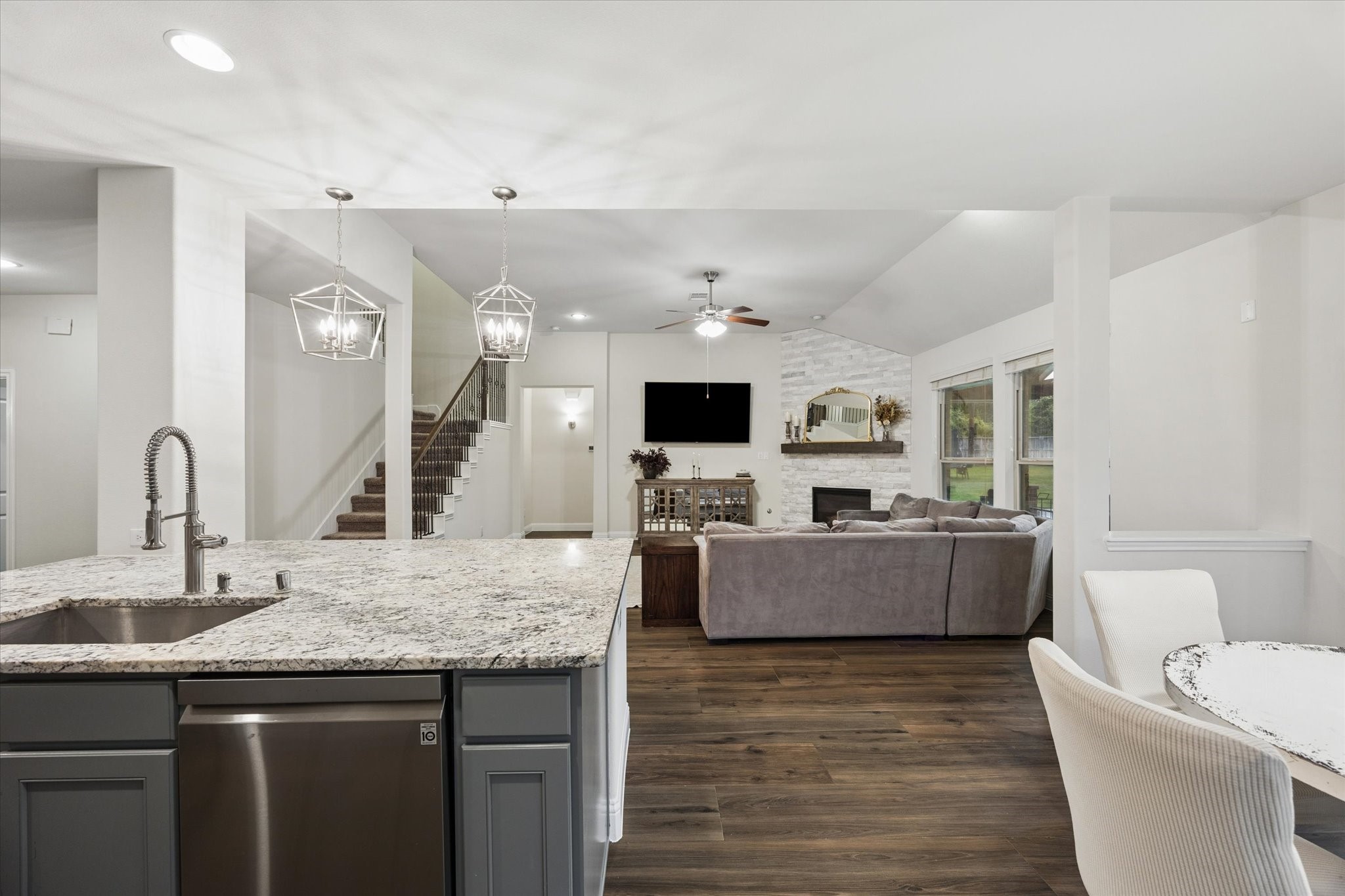 The kitchen flows effortlessly into the breakfast area and living spaces, creating a functional entertaining space.