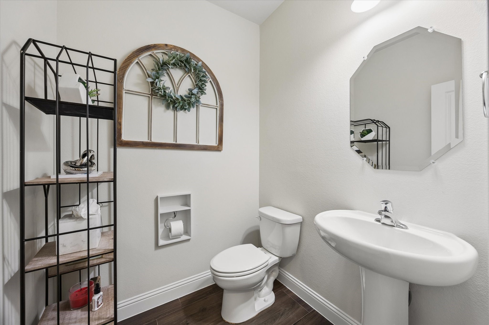 Charming powder room not too close to the kitchen with farmhouse accents.
