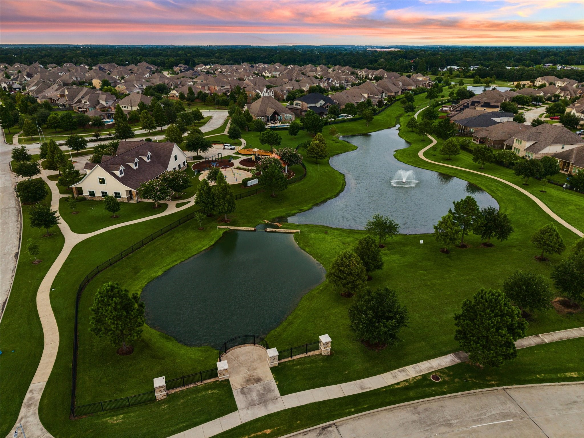 Experience the beauty and appeal of Falls at Dry Creek from above, where thoughtfully designed neighborhoods surround picturesque waterways and lush green spaces.