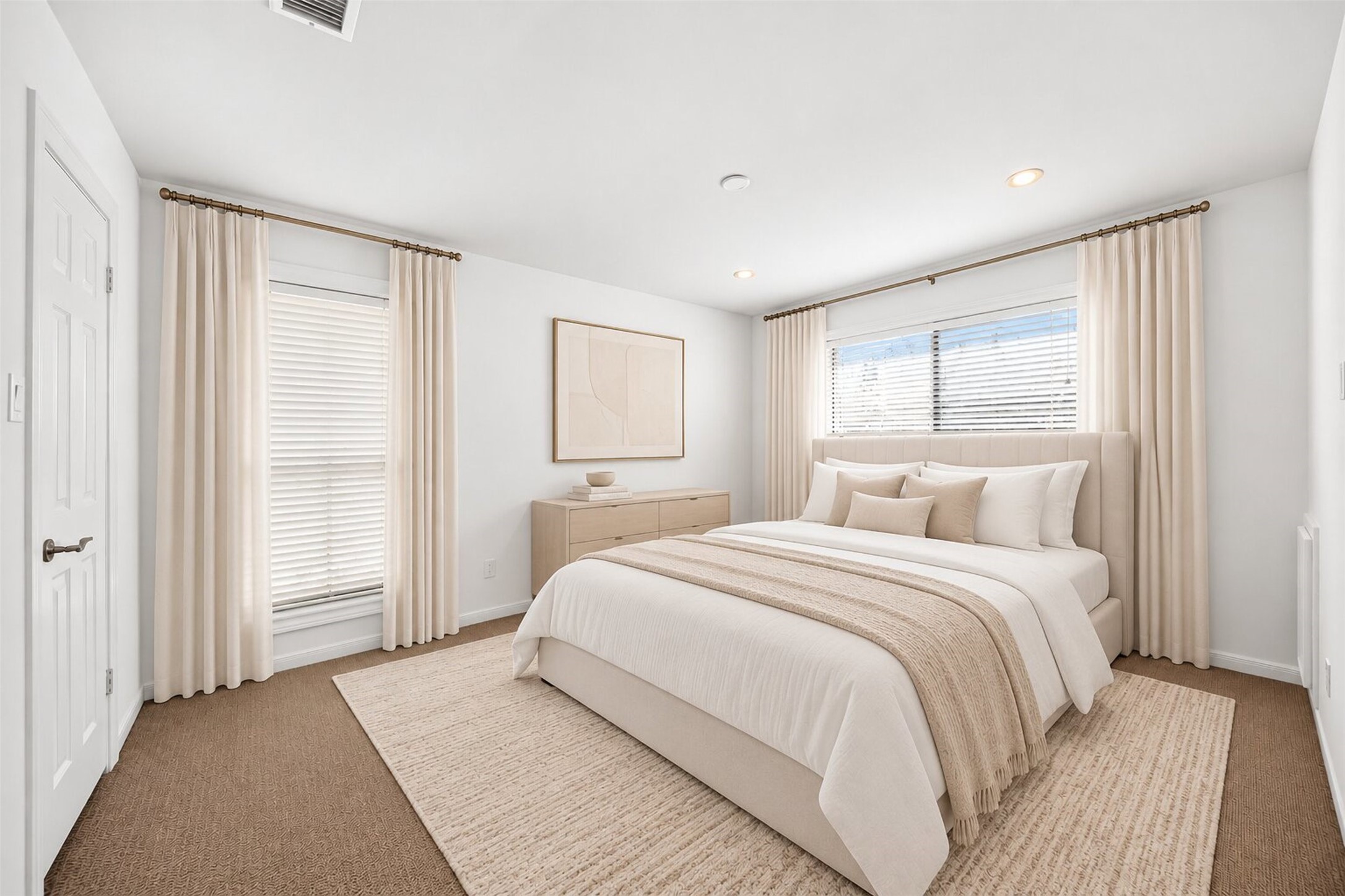 Virtually staged secondary bedroom with corner windows and neutral furnishings.