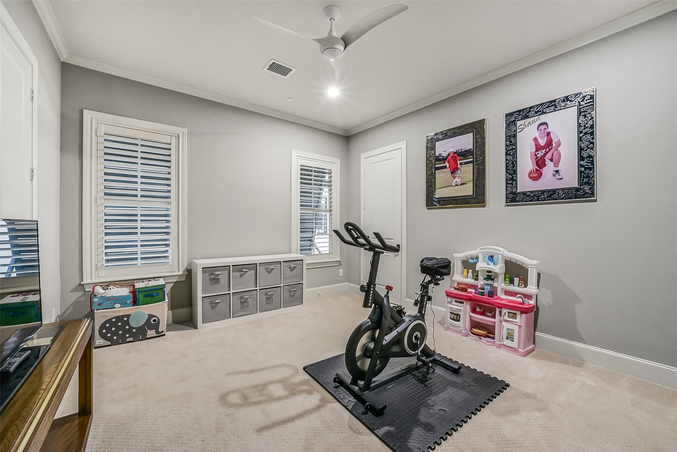 Bedroom 4 is currently being used as a versatile flex space ready to fit your lifestyle, whether as a playroom, home gym, media room, or guest bedroom.