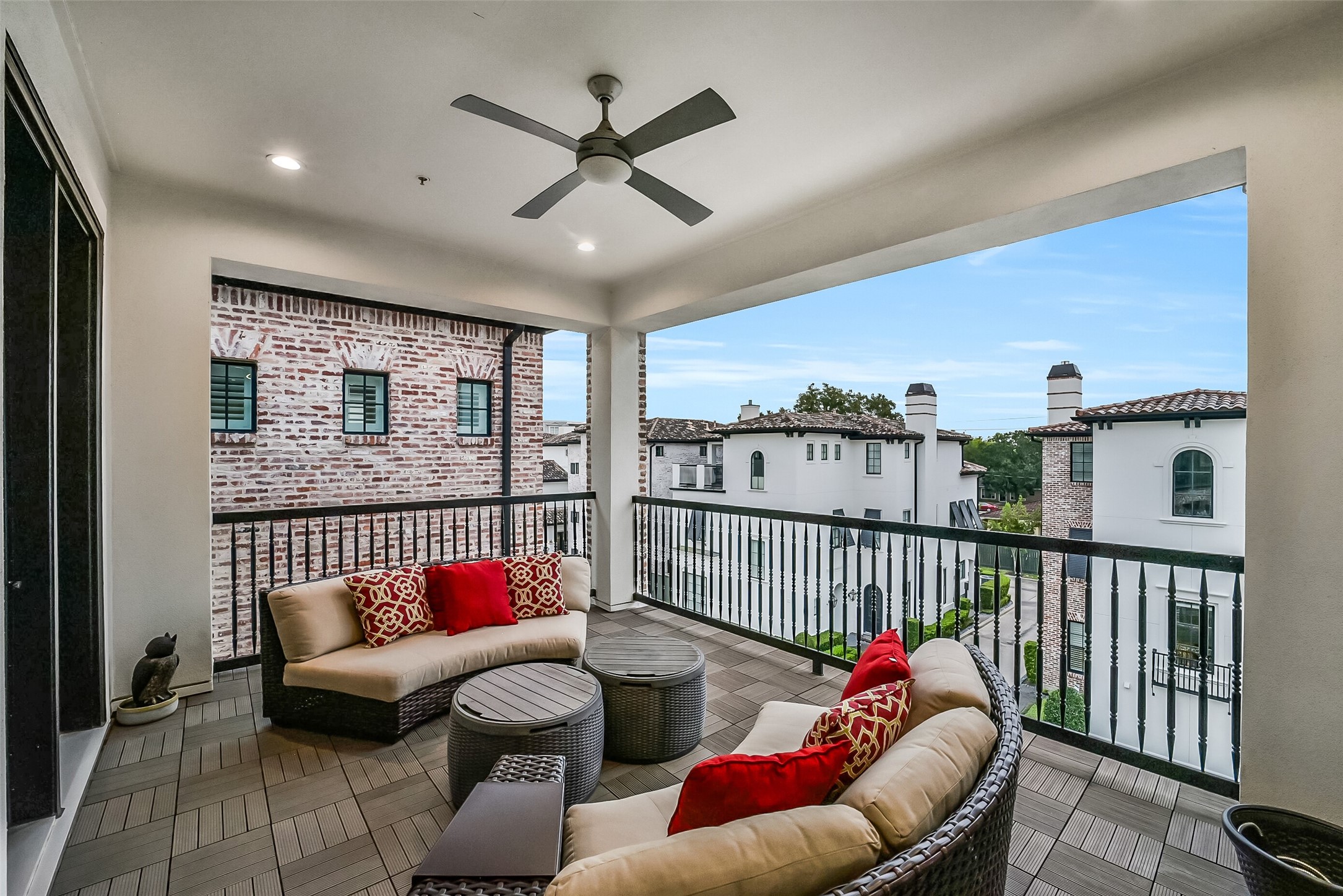 Private third-floor balcony accessed directly from the game room, providing a serene outdoor retreat with elevated neighborhood views.