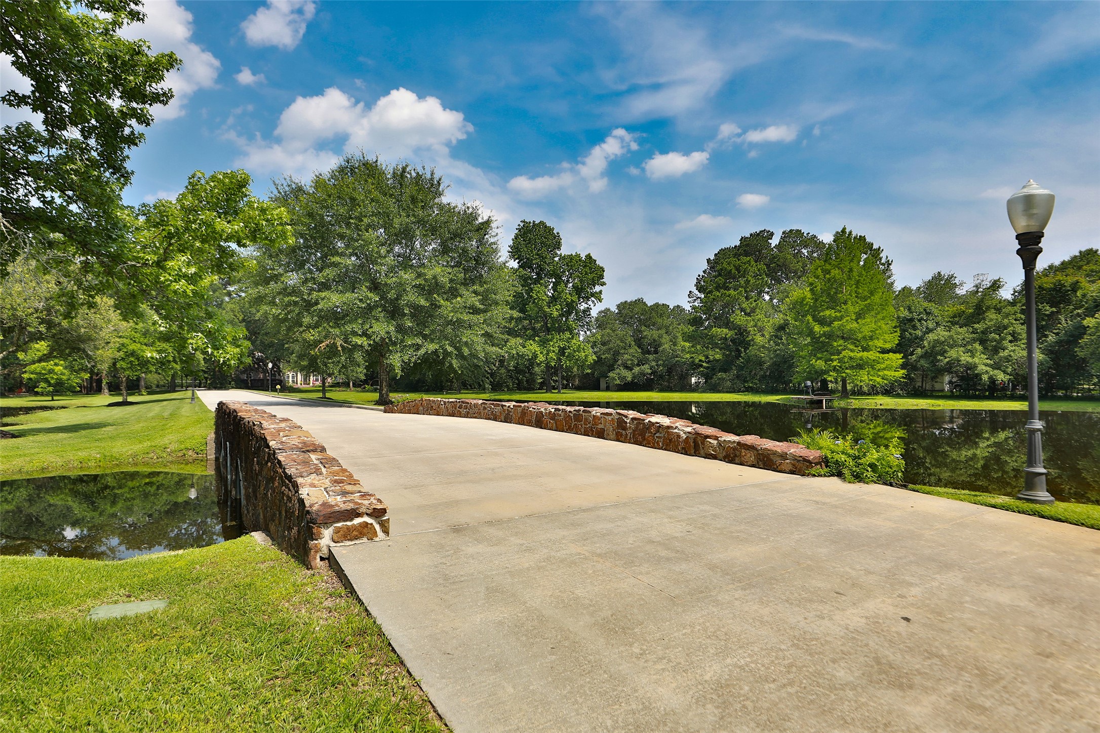 Imagine coming home every day to this breathtaking view! As you cross the charming stone bridge overlooking your private stocked pond, you're welcomed by the beauty and tranquility of your own estate. This isn't just a drivewayit's an unforgettable entrance to a place you'll love calling home! Imagine coming home every day to this breathtaking view! As you cross the charming stone bridge overlooking your private stocked pond, you're welcomed by the beauty and tranquility of your own estate. This isn't just a drivewayit's an unforgettable entrance to a place you'll love calling home!