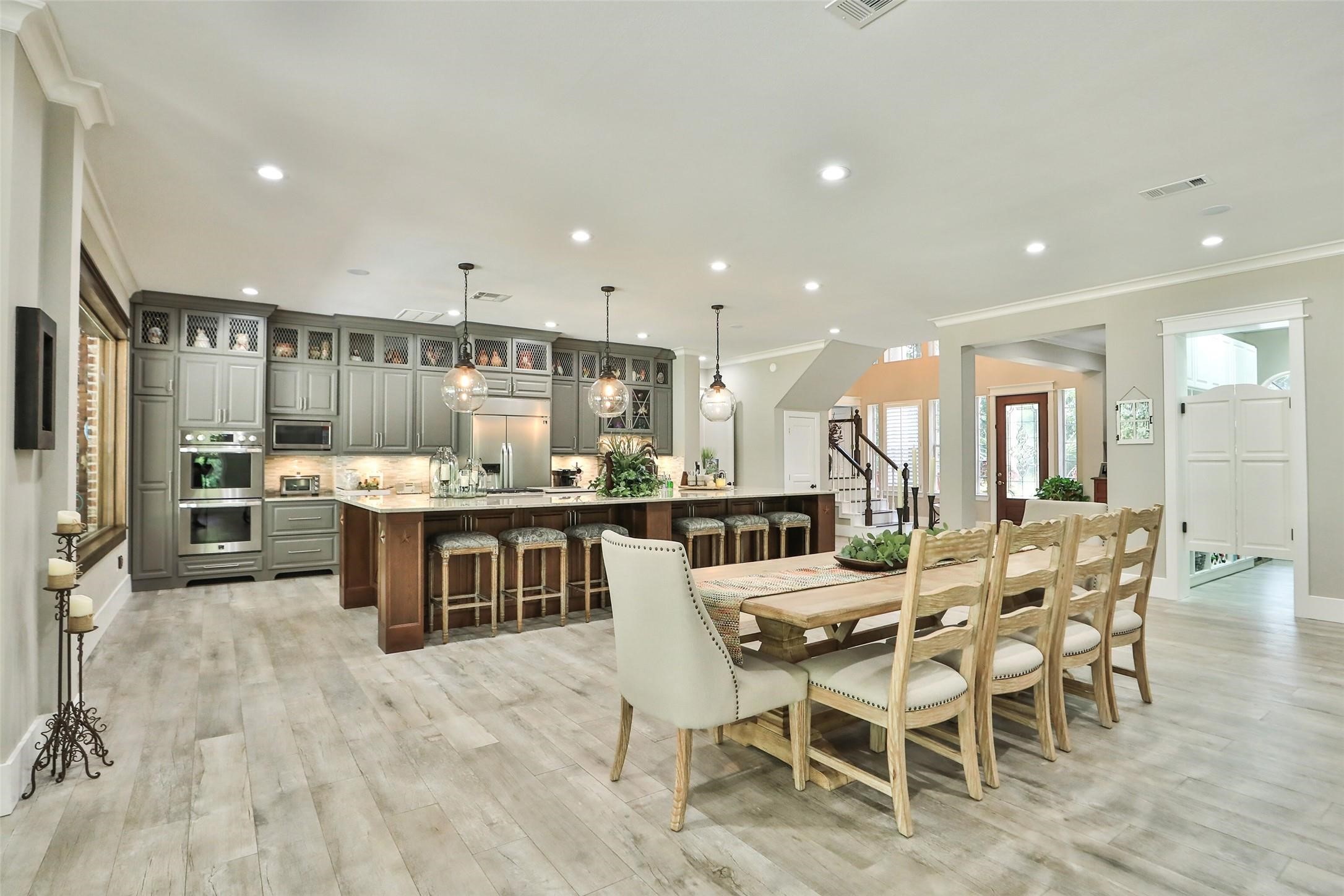 Stunning custom kitchen with LG Studio appliances, Kohler farmhouse sink, Quartzite counters, 15' x 7' solid cherry island, custom maple wood cabinets, dovetailed drawers, Pottery Barn pendant lighting, breakfast bar with plenty of storage under the island.