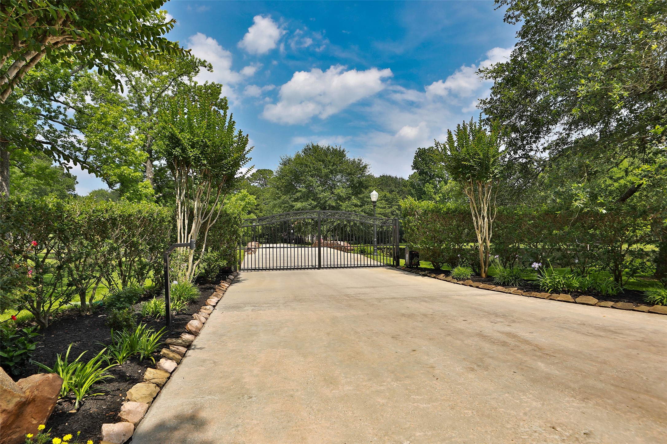 Beautifully landscaped gated entrance with Lift-Master gate motors, keypad and remotes. Beautifully landscaped gated entrance with Lift-Master gate motors, keypad and remotes.