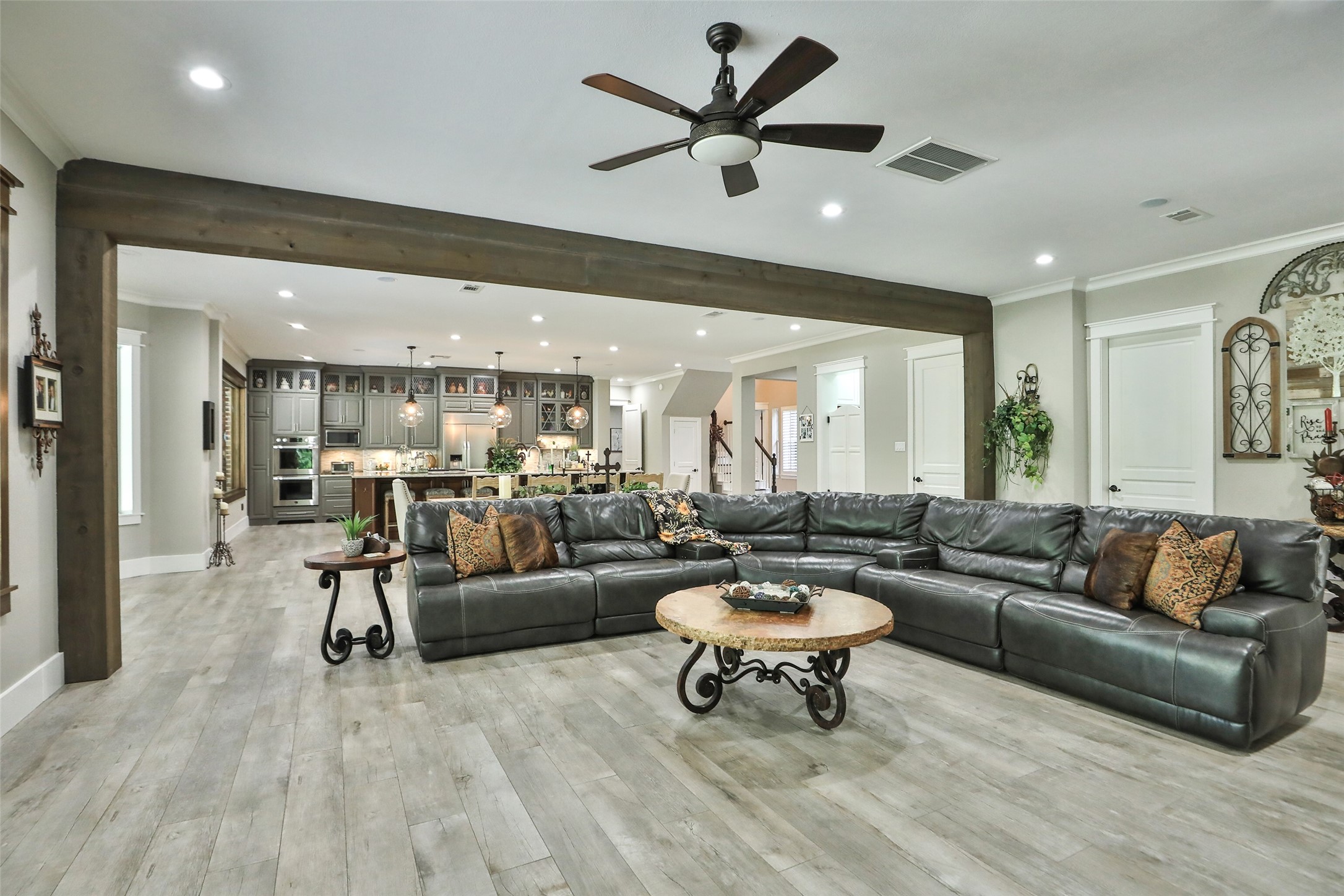 Now this is a GREAT room where you can enjoy an intimate evening or large gathering. Remodeled with wood look tile floors, paint and new custom kitchen