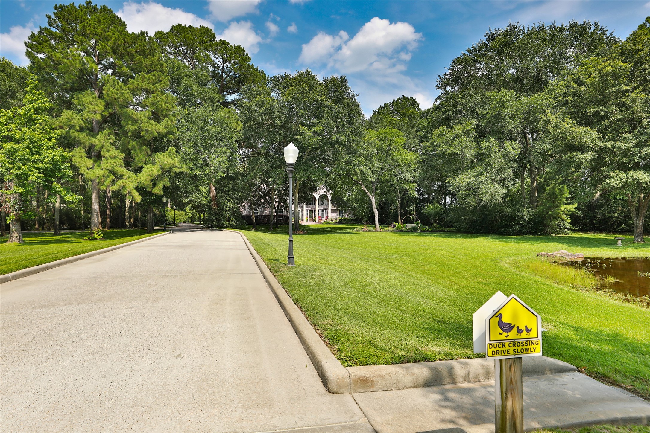 Experience a grand arrival as you cross the picturesque stone bridge and follow the light-lined driveway leading to a stunning custom-built home. Every turn welcomes you with beauty, charm, and a sense of arriving somewhere truly special! Experience a grand arrival as you cross the picturesque stone bridge and follow the light-lined driveway leading to a stunning custom-built home. Every turn welcomes you with beauty, charm, and a sense of arriving somewhere truly special!