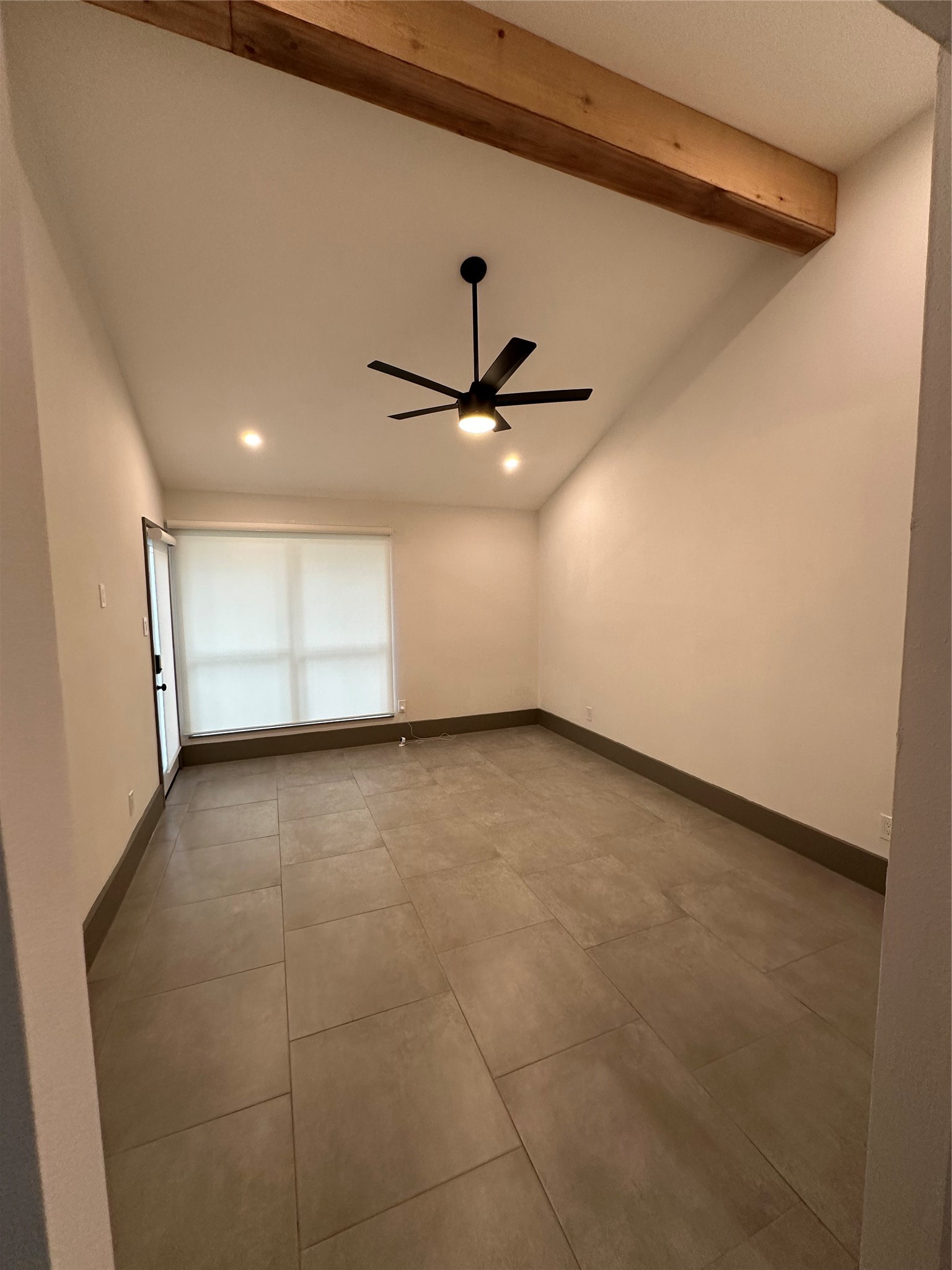 Primary Bedroom with high ceilings, Faux beams, and Tons of Light.