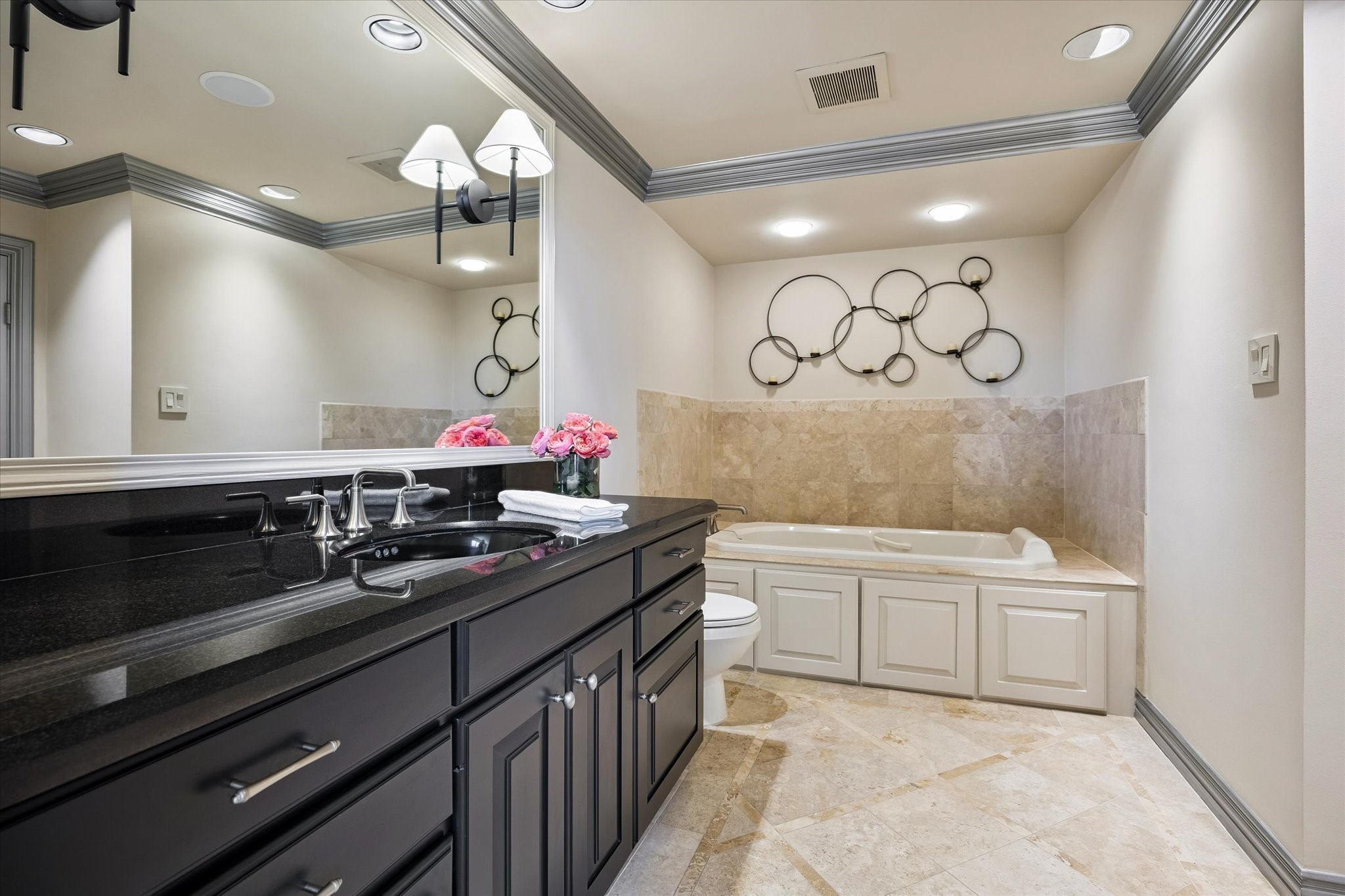 Jetted, soaking tub and extended vanity.