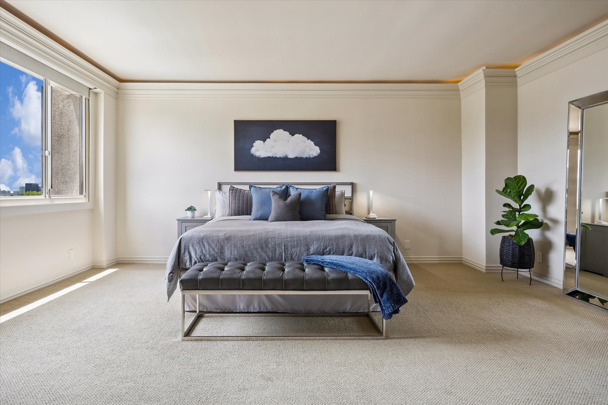 Huge primary suite with spa-like bath and two walk-in closets.