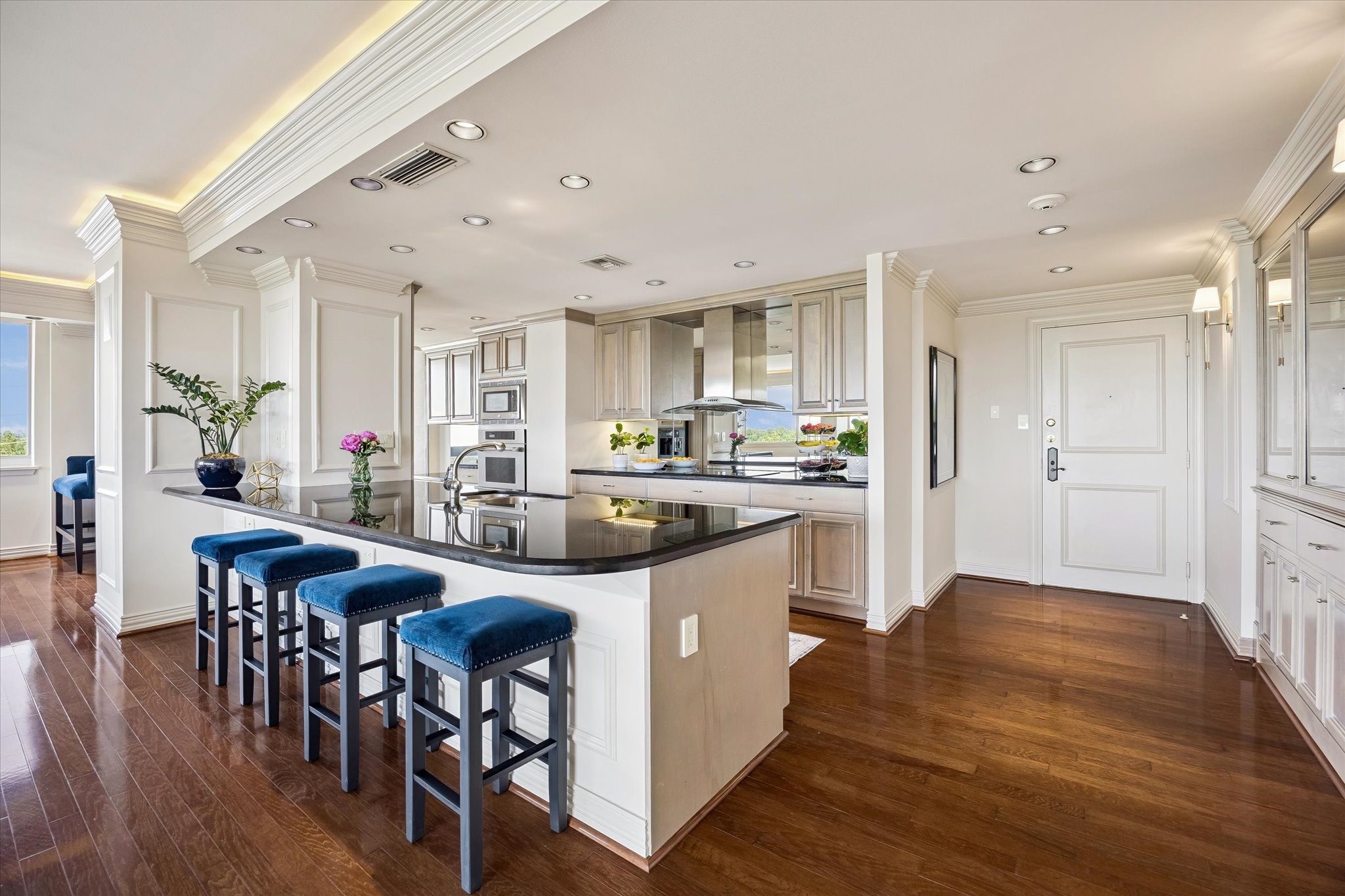 Updated kitchen with tons of storage and mirrored backsplash.
