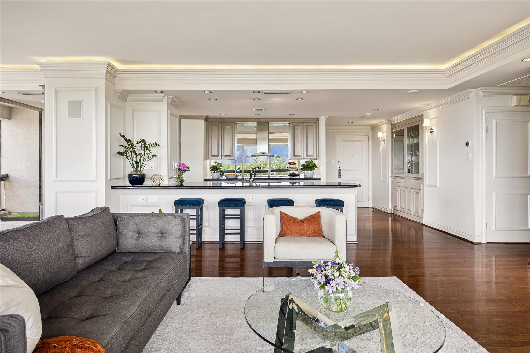 Breakfast bar opening to living and dining.